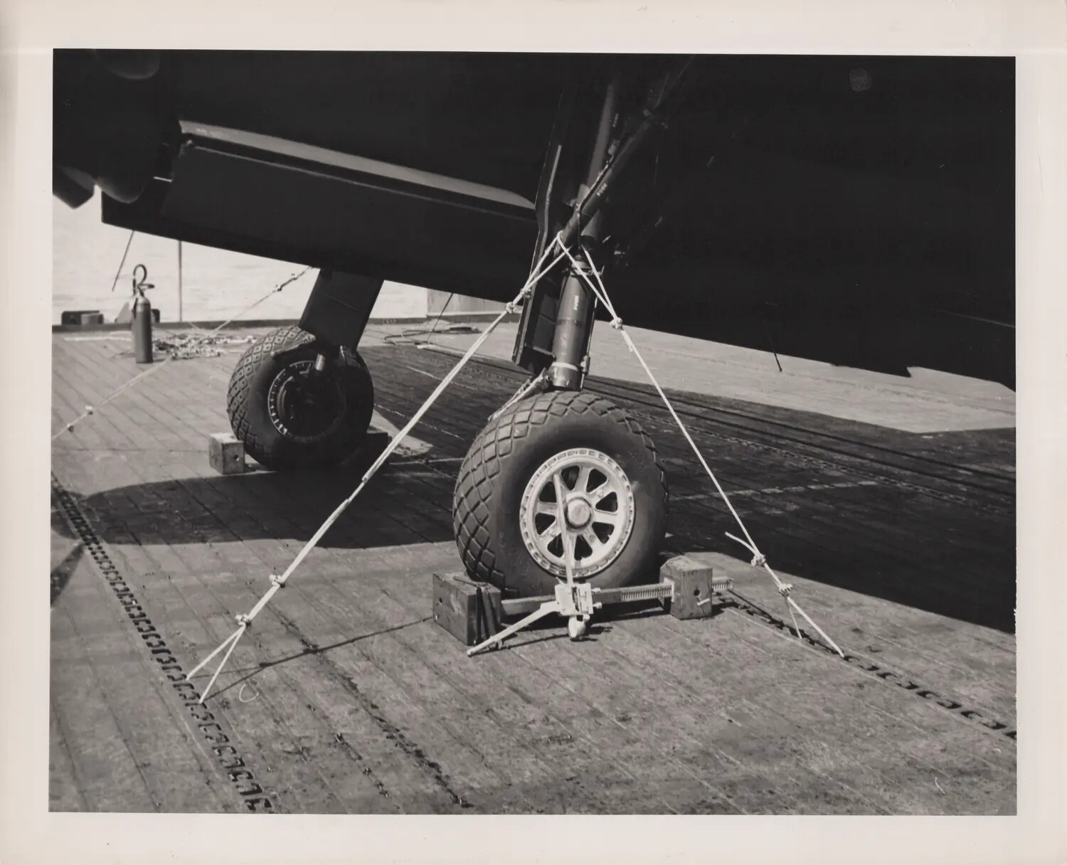 Aircraft Landing Gear Tied Down on Flight Deck, U.S. Navy Escort Carrier, WWII