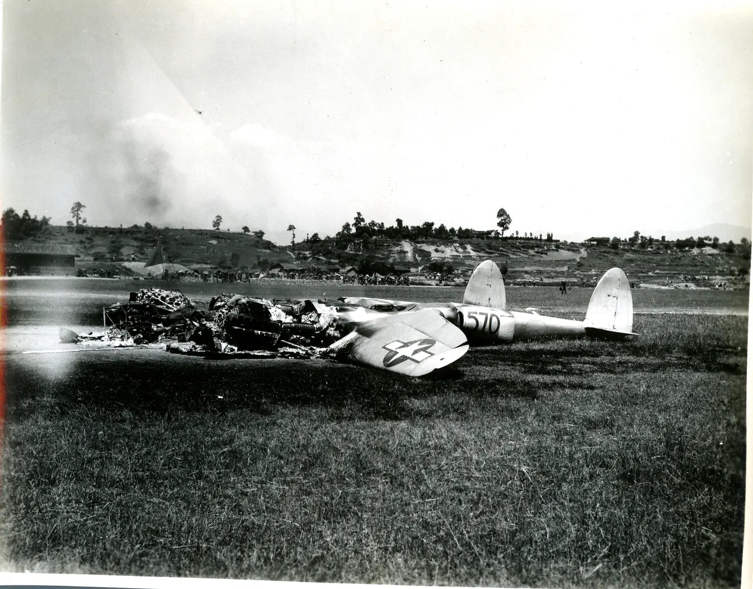 Wreckage of Burned Twin-Boom U.S. Fighter Aircraft (Possible P-38 Lightning), China-Burma-India Theater, WWII