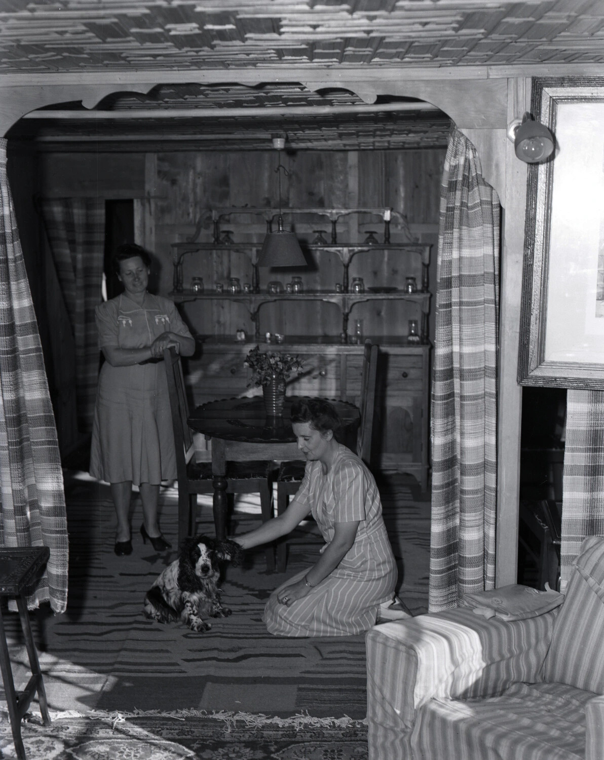 Two Women with Spaniel Dog in a Kashmiri Houseboat Interior, WWII-era, Kashmir