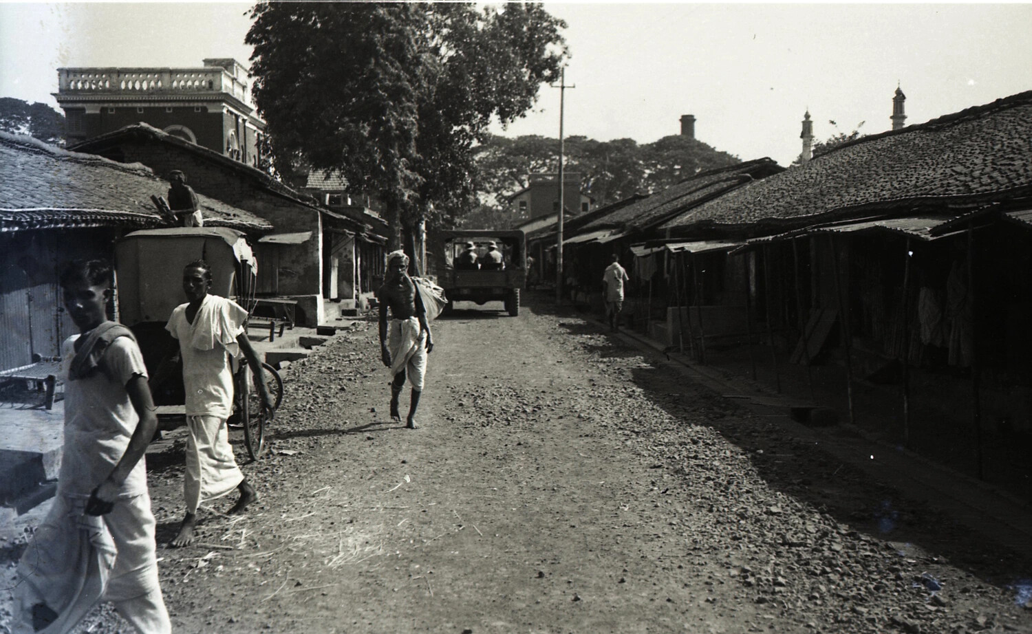 Street Scene with Local Residents and U.S. Military Truck, China-Burma-India Theater, WWII
