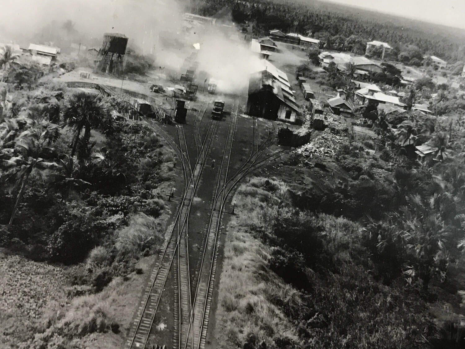 Low-Level Strike Photograph of Railway Junction and Water Tower Under Attack, Philippines, 312th Bomb Group