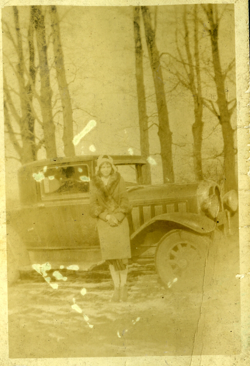 Woman Beside a Vintage Automobile in Snow, Manila Photo Album