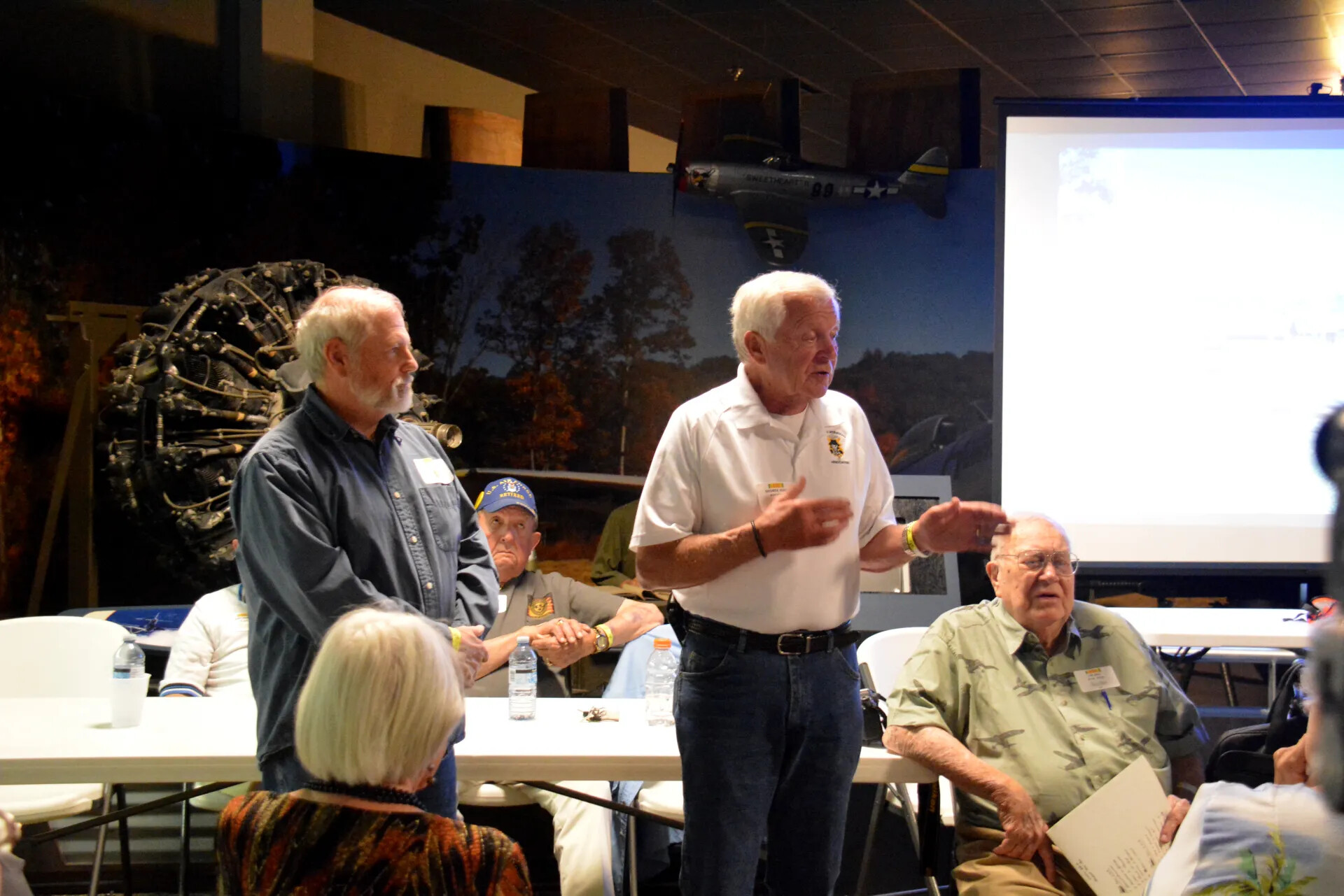 Veterans Address Reunion Audience Beneath Model P-47 Thunderbolt Display, Skyraider Association Meeting, 2 May 2015