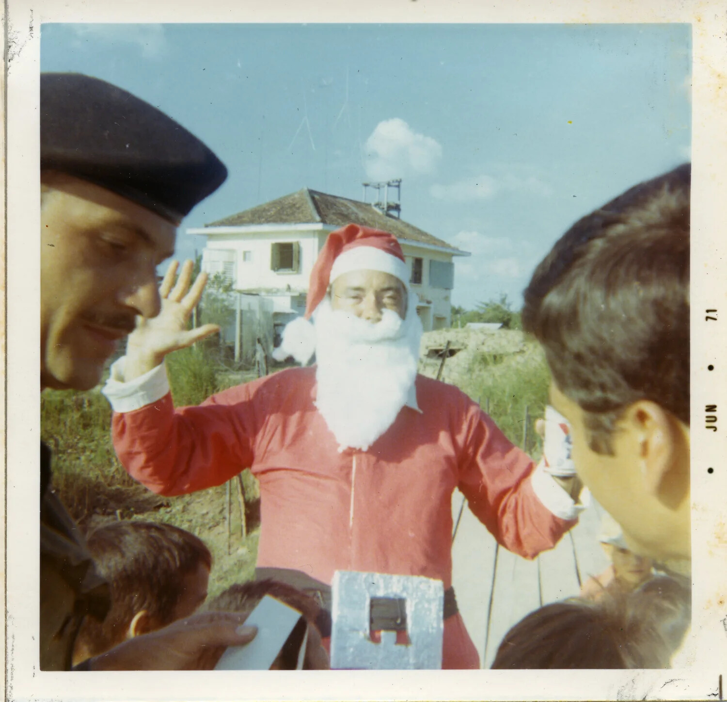 'Santa Claus' Distributing Gifts to Children at a Vietnam Installation, 1971