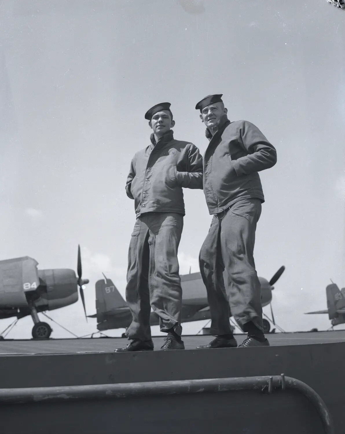 Flight Deck Crewmen Aboard USS Petrof Bay (CVE-80) with Parked Wildcat Fighters