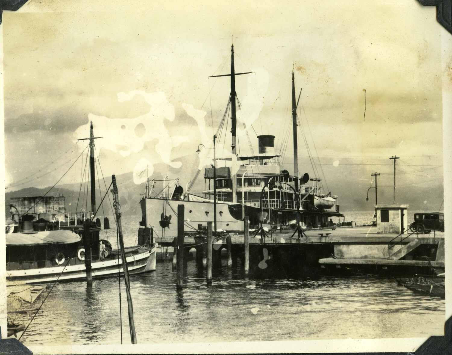 Coastal Steamship and U.S. Army Vessel at Pier, Philippine Harbor, c. 1920s-1930s