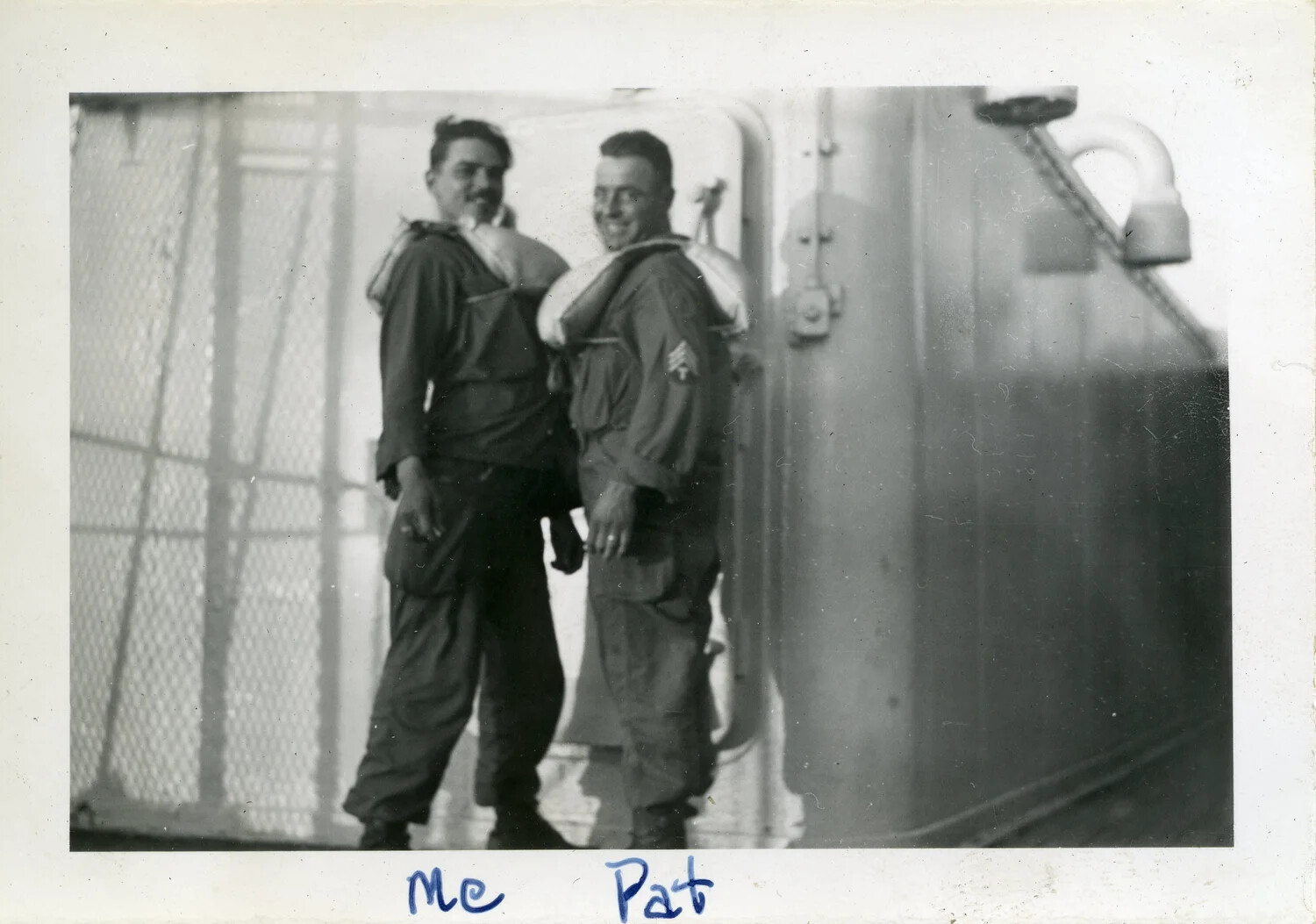 Two Soldiers of the 44th Infantry Division Wearing Life Preservers Aboard Troopship, WWII
