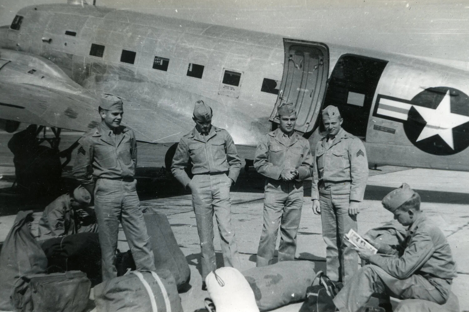Marines Awaiting Transport Beside a Douglas C-47/R4D Skytrain, VMF-214 Album, 1945