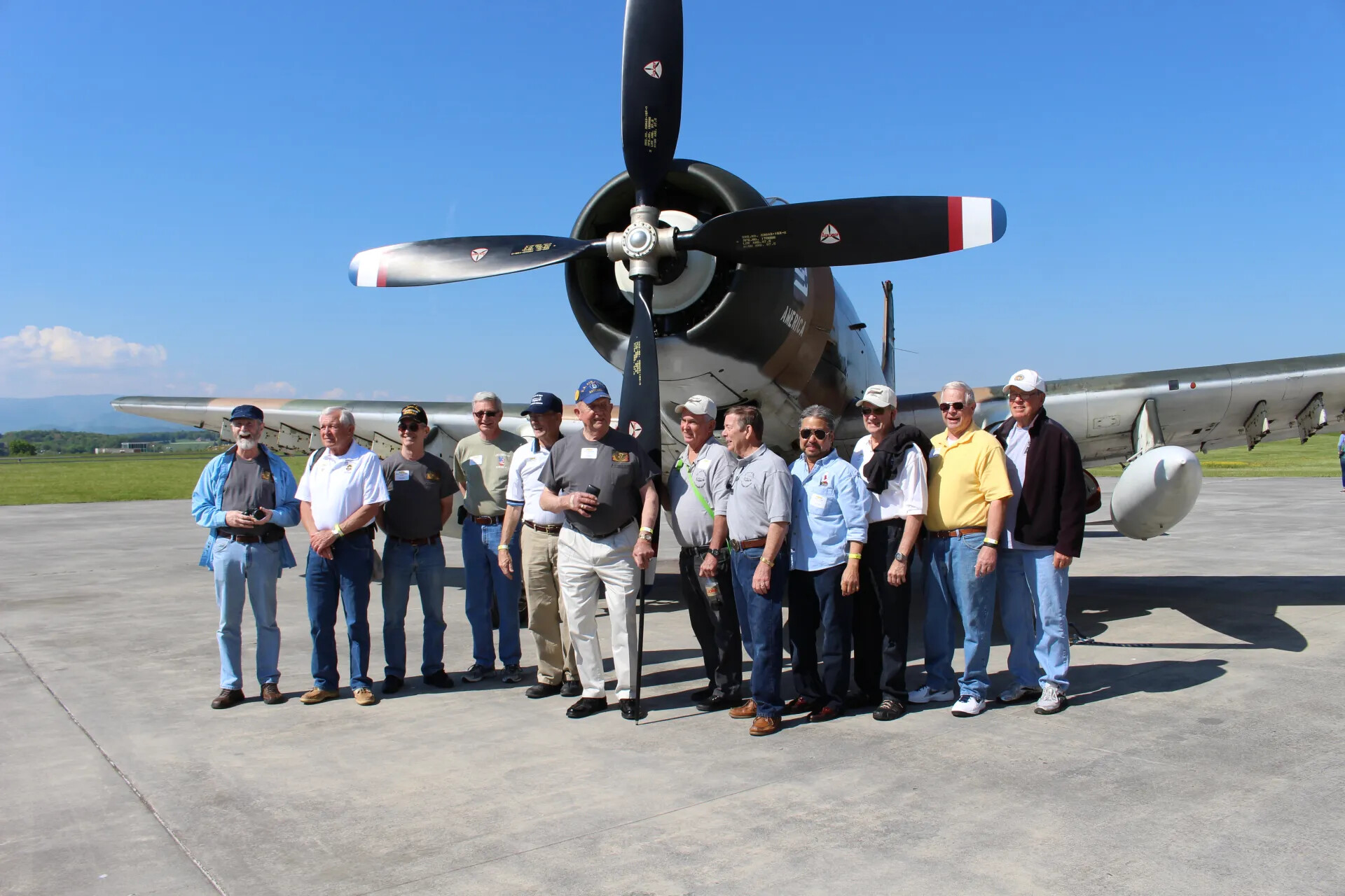 Veterans' Reunion Group Photo in Front of Restored Radial-Engine Aircraft, 'Jim Wold Day,' May 2, 2015