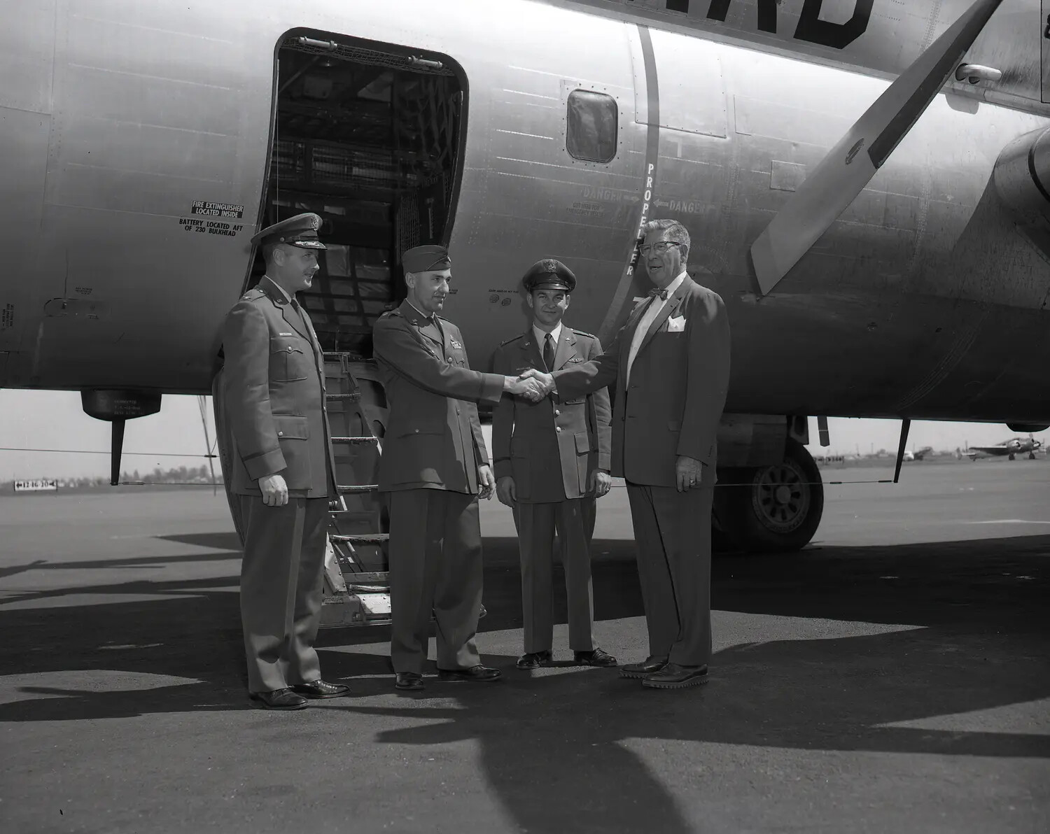 Air Force Officer and Civilian Exchange Handshake at C-97 Airstair, California Air National Guard, circa 1960