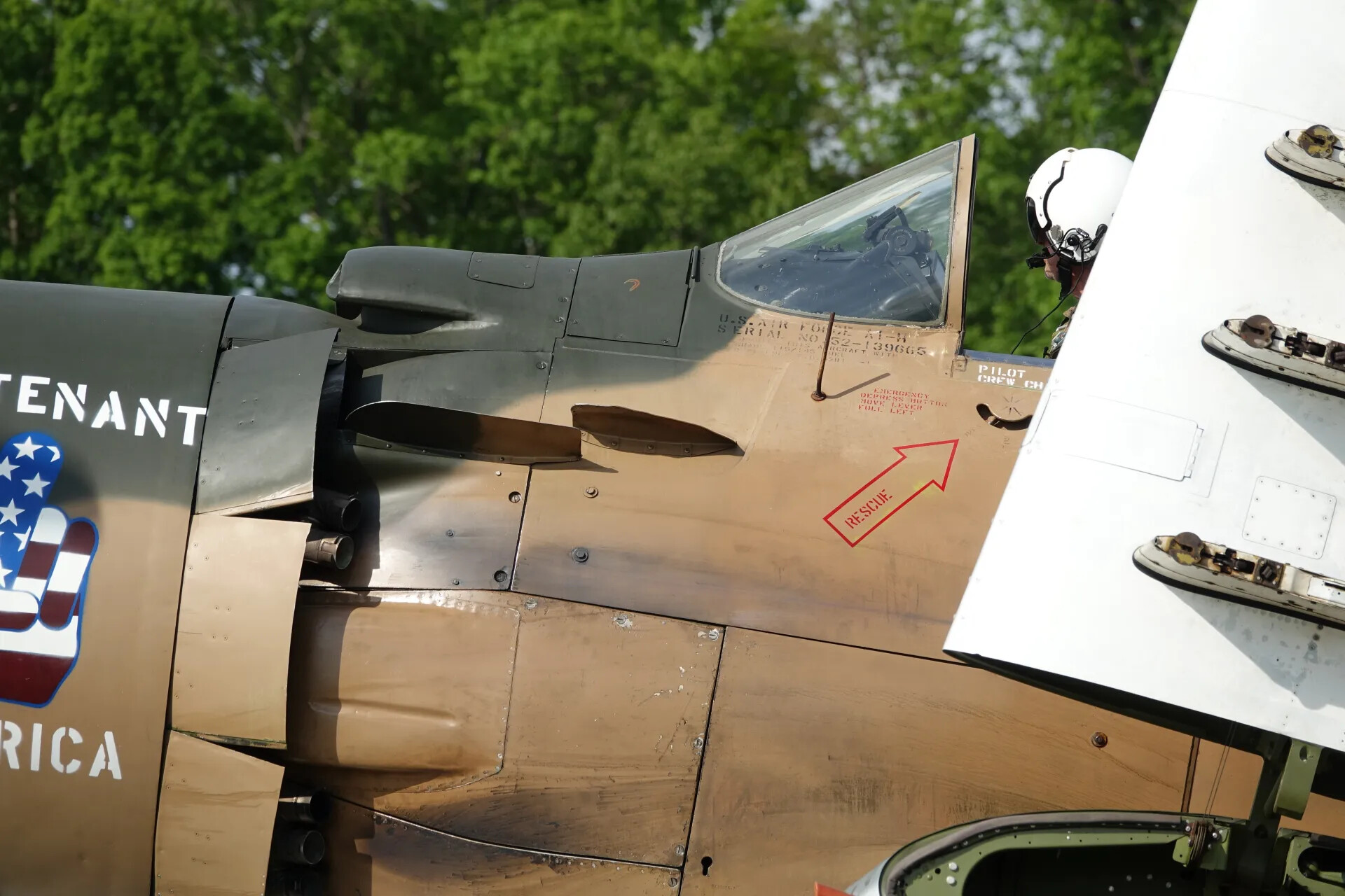 Pilot in Cockpit of A-1 Skyraider 'Lieutenant America,' Data Placard Visible