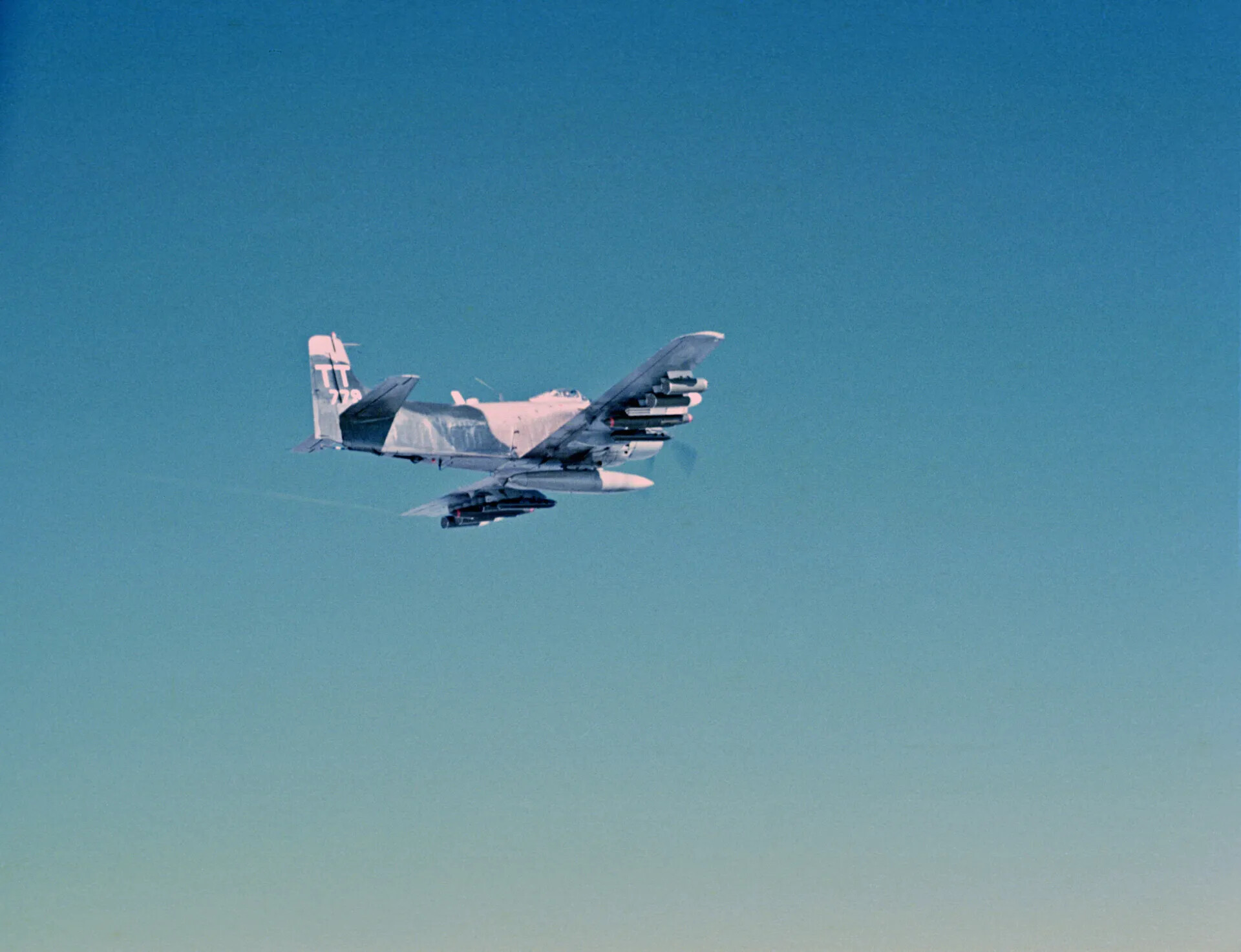 Douglas A-1 Skyraider "TT-779" in Banking Turn, Companion Frame, Southeast Asia, circa January 1970