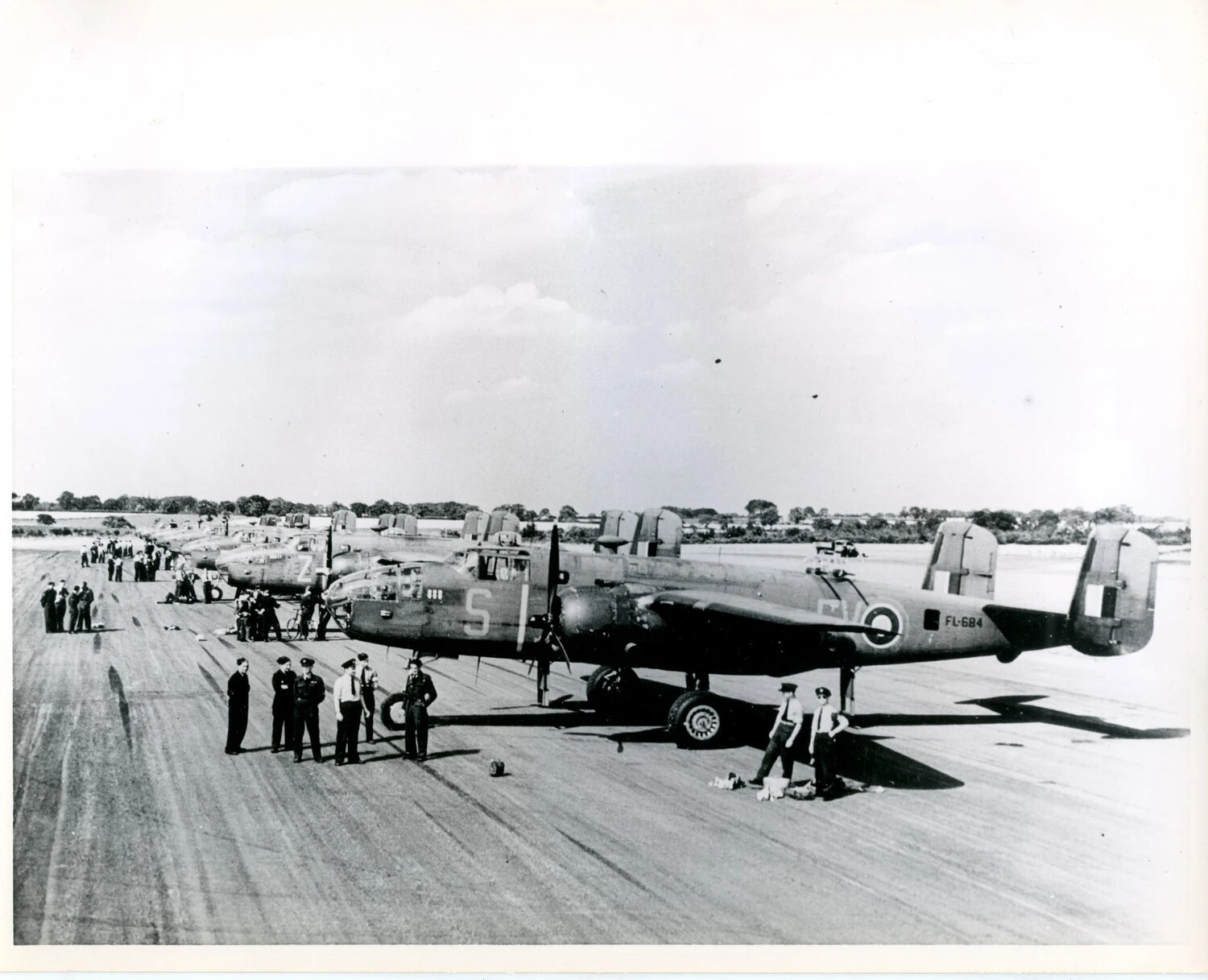 North American Mitchell II Bombers of No. 180 Squadron RAF, Serial FL-684, Lined Up on Airfield