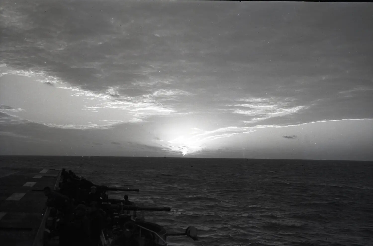 Sunset Over the Pacific with Gun Crews at the Ready, USS Petrof Bay (CVE-80), WWII Era