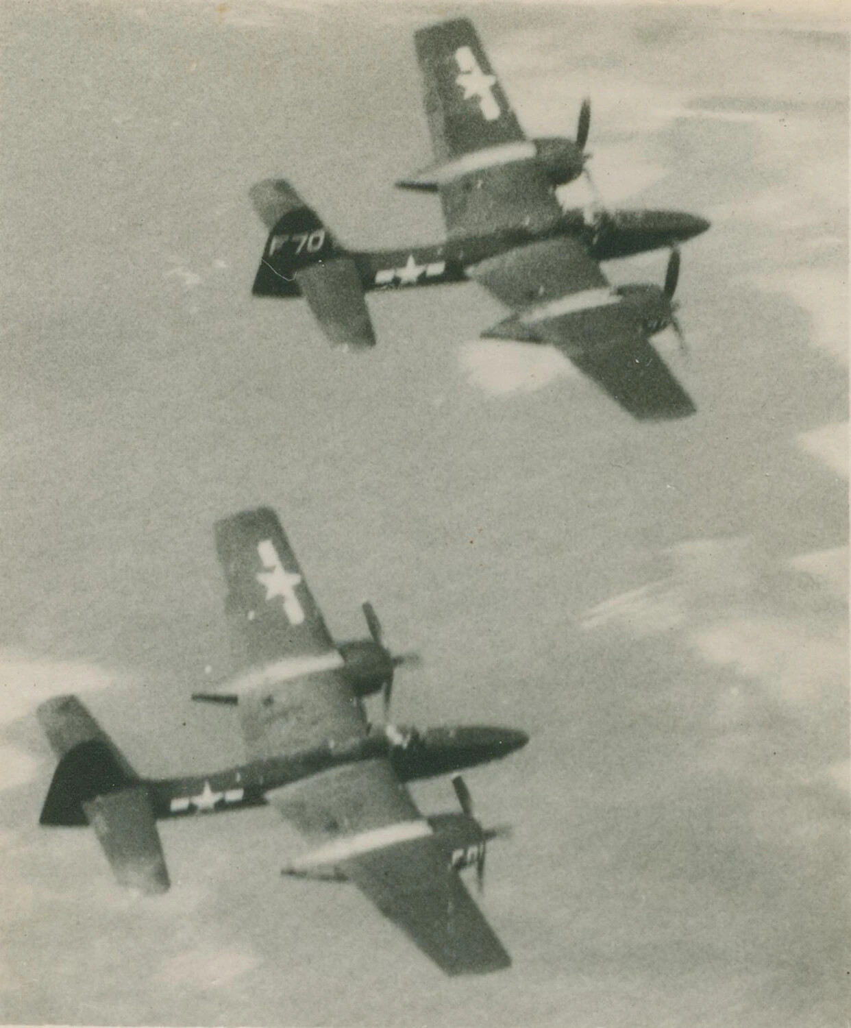 Formation of Twin-Engine Fighter Aircraft (Likely Grumman F7F Tigercats) in Banking Flight