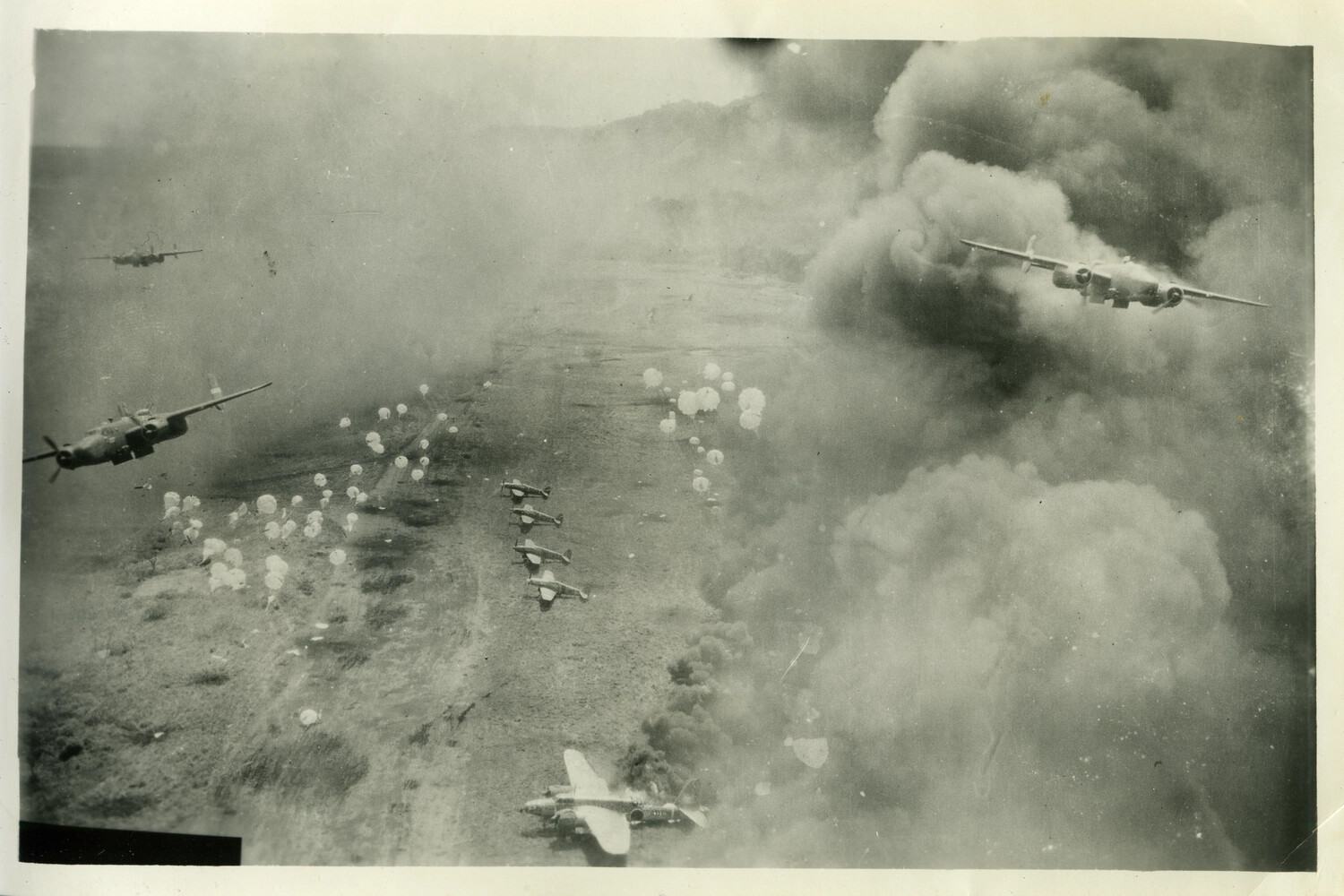 Low-Level Parafrag Bombing Attack on Japanese Airfield by B-25 Mitchell Bombers, WWII Pacific Theater