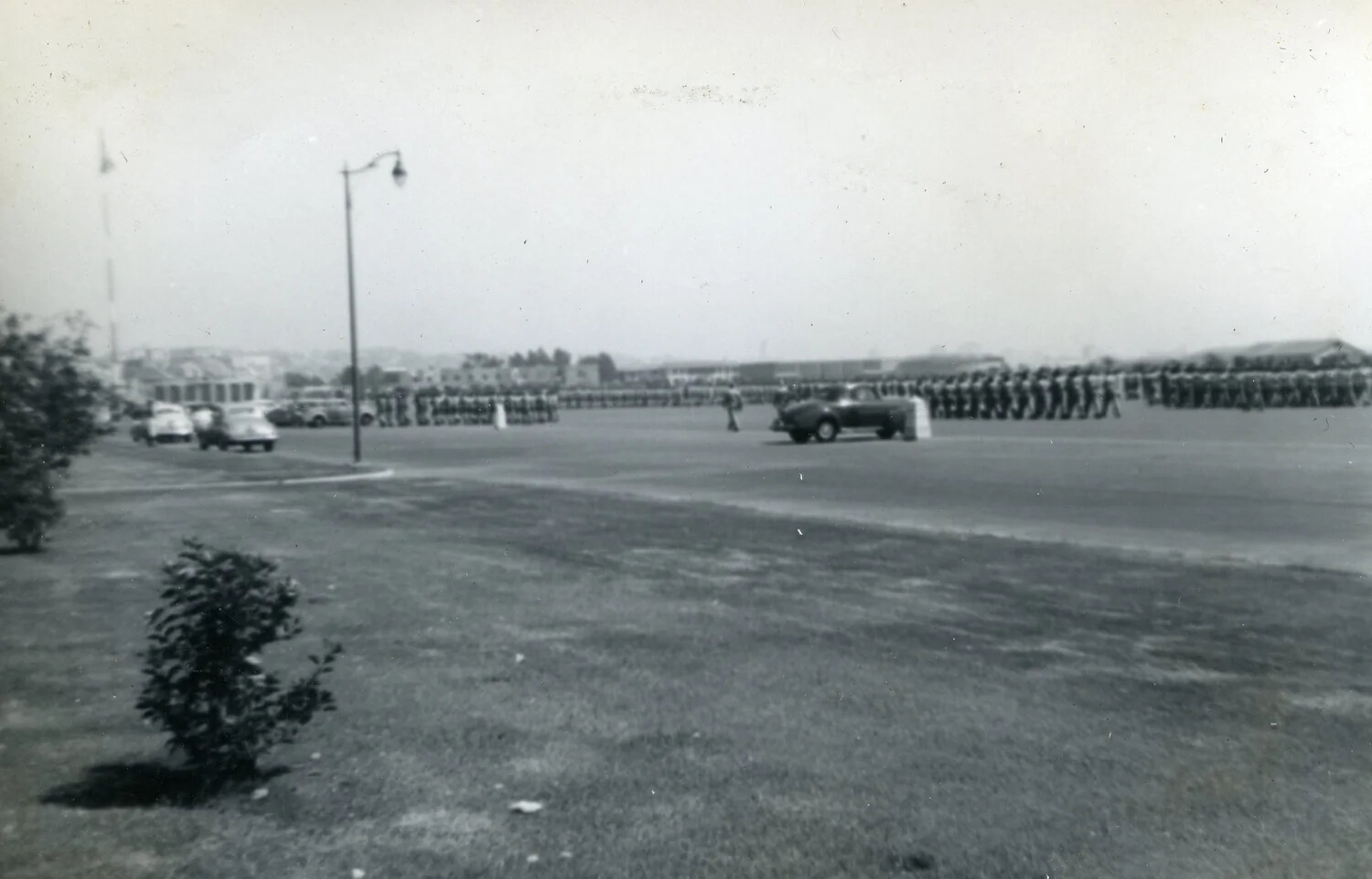 Military Parade Ground Review with Troop Formations and Staff Car