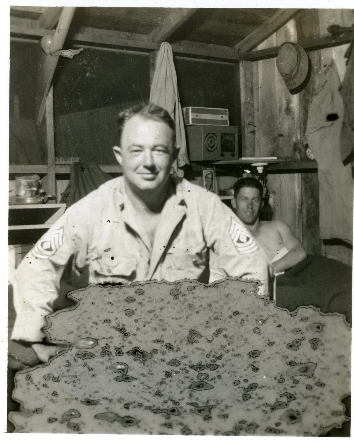 U.S. Army First Sergeant Displaying a Large Snake Skin Souvenir, Pacific Theater, WWII