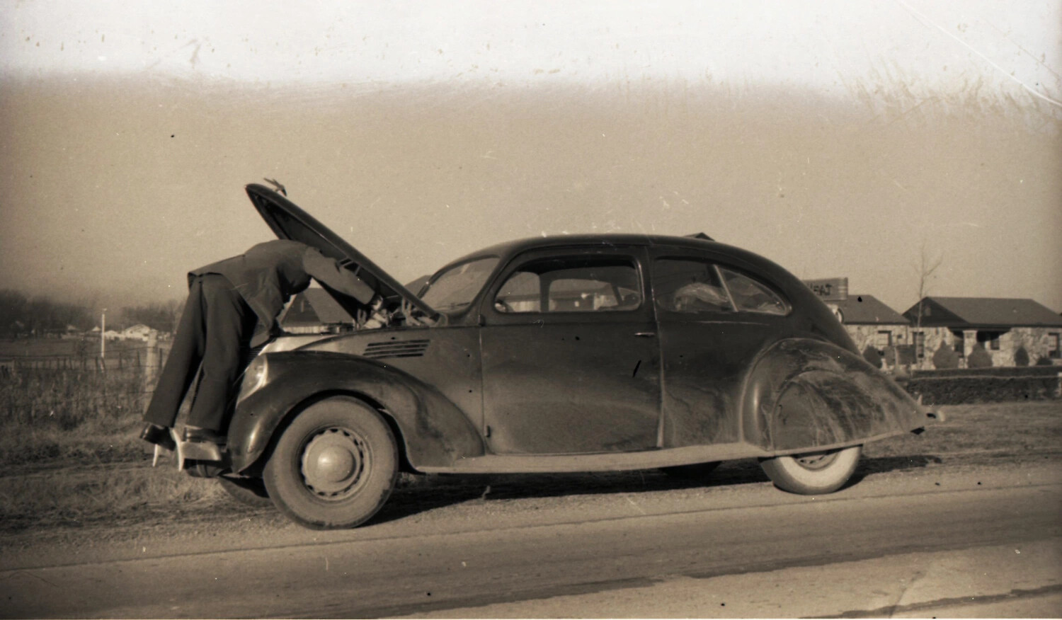 Roadside Automobile Repair, Late 1930s Streamlined Sedan