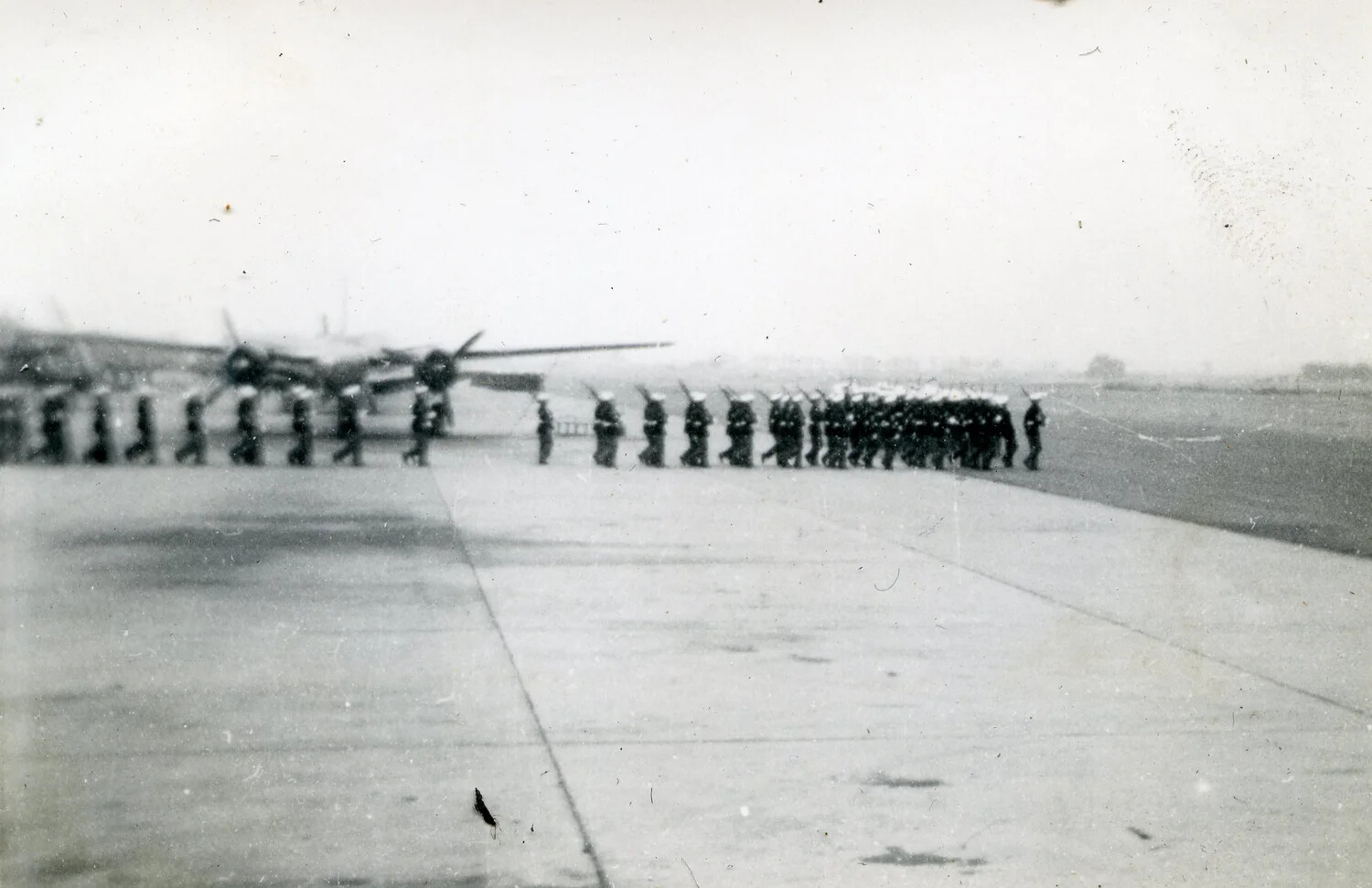 Marine Corps Personnel in Marching Formation on Airfield Apron, VMF-214 Album, 1945