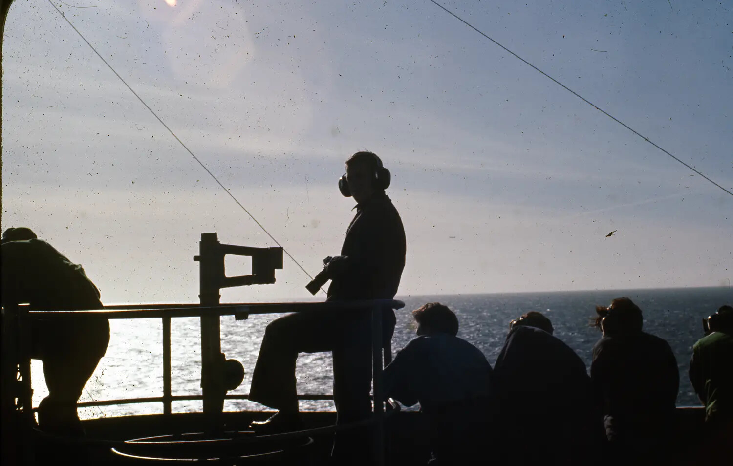 Sailors Silhouetted Against the Sun on the Flight Deck of USS Ticonderoga, Vietnam War Era