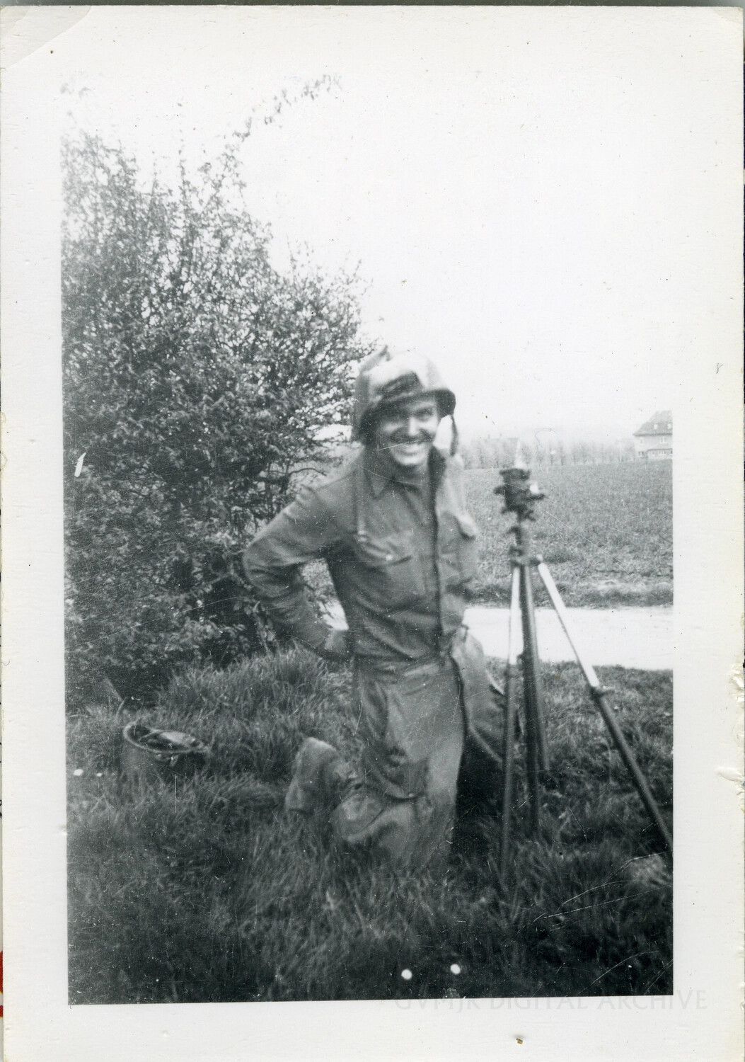 Soldier with Surveying Tripod Instrument in Open Field, European Theater, WWII