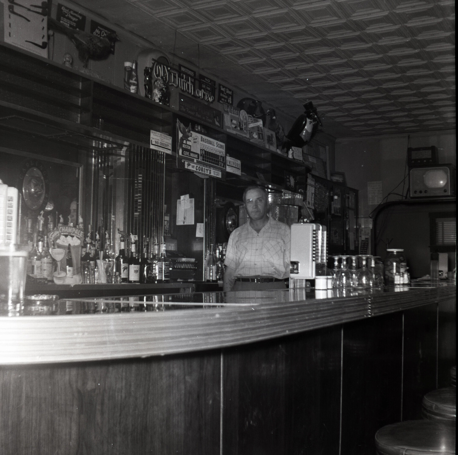 Bartender Behind the Bar at Corey's Tavern, Mid-20th Century