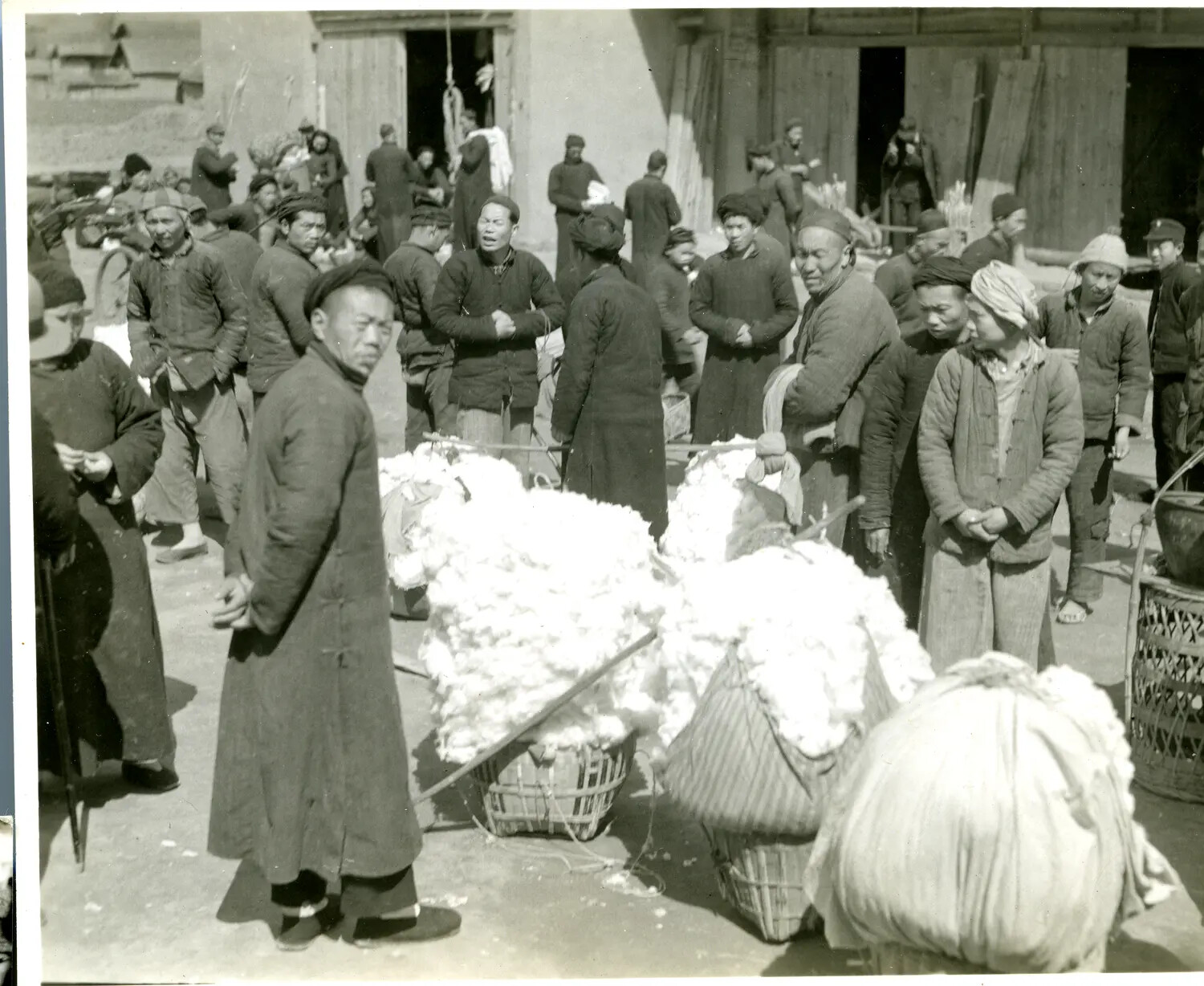 Chinese Civilians with Cotton Bales — China-Burma-India Theater, World War II