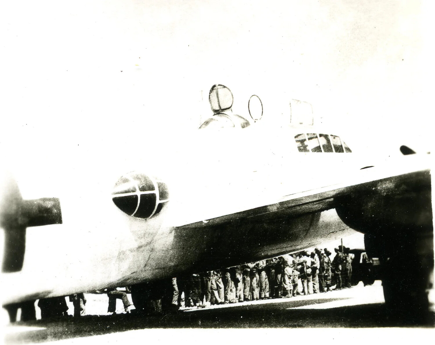 Close-Up of Nose and Cockpit of White-Painted 'Betty' Bomber with Crowd of Servicemen Beneath, Ie Shima Envoy Flight, August 19, 1945