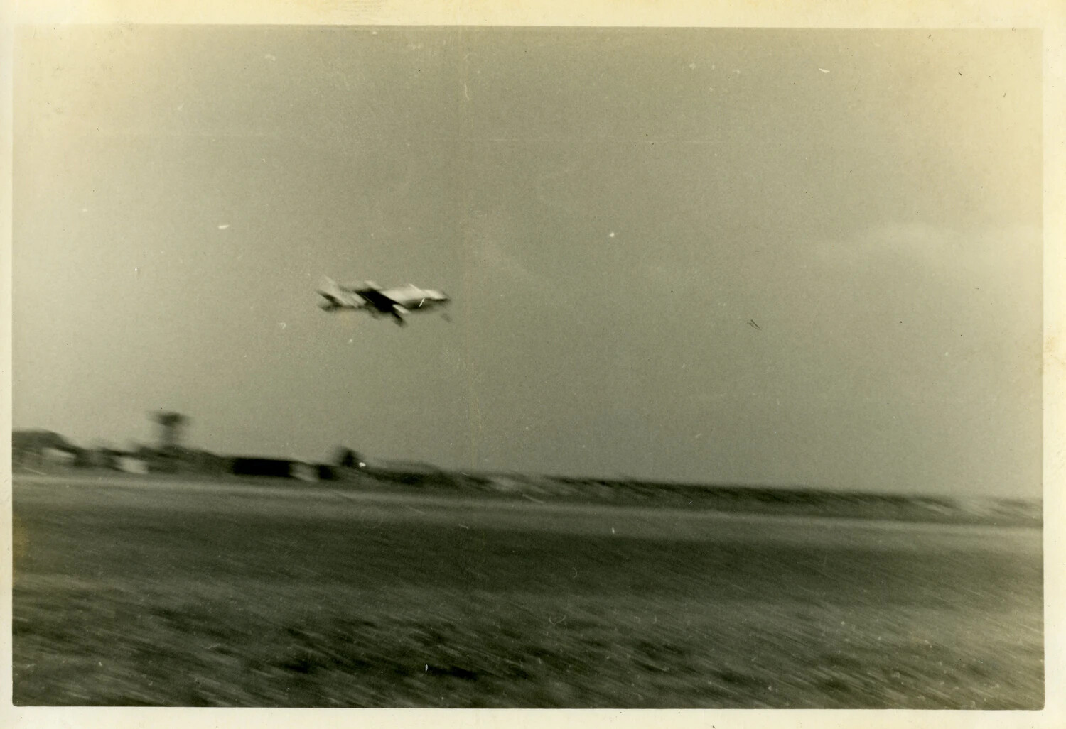 Low-Altitude Aircraft Flyby Over Military Airfield