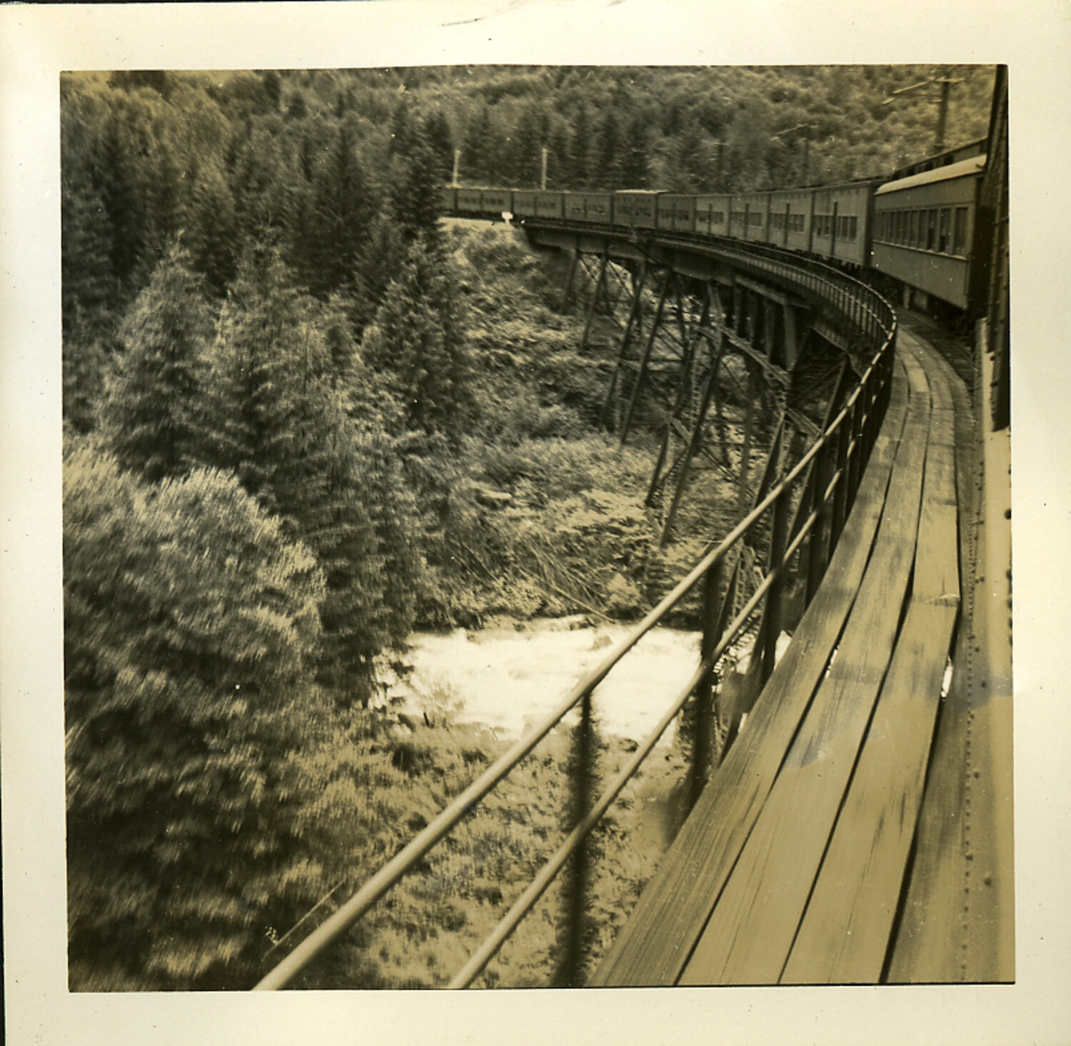 Passenger Train Crossing Mountain Trestle Bridge, Transcontinental Rail Journey