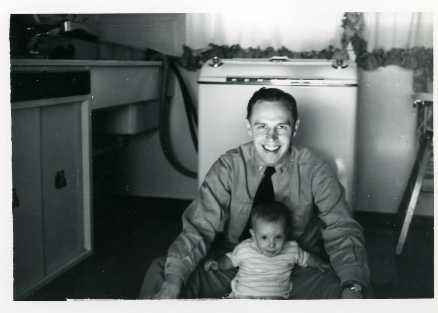 Serviceman with Child in Home Kitchen, Korean War Era Family Snapshot