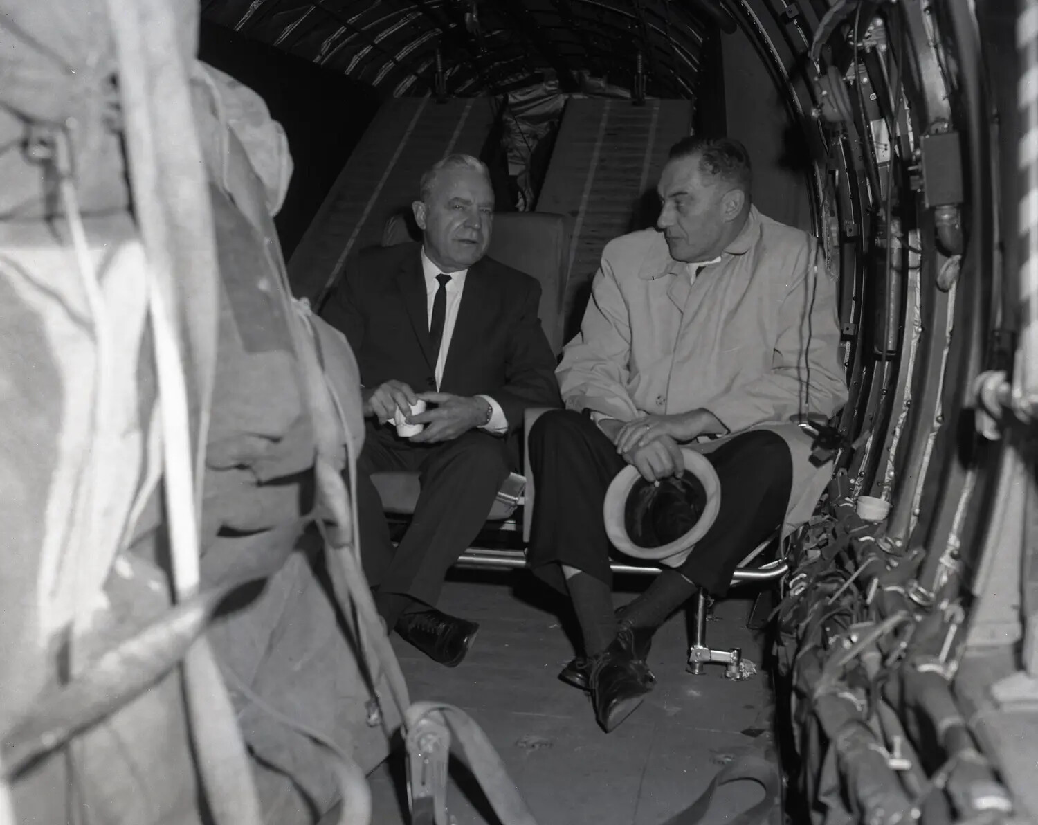 Civilian Passengers Seated in the Cargo Hold of a California Air National Guard C-97 Transport