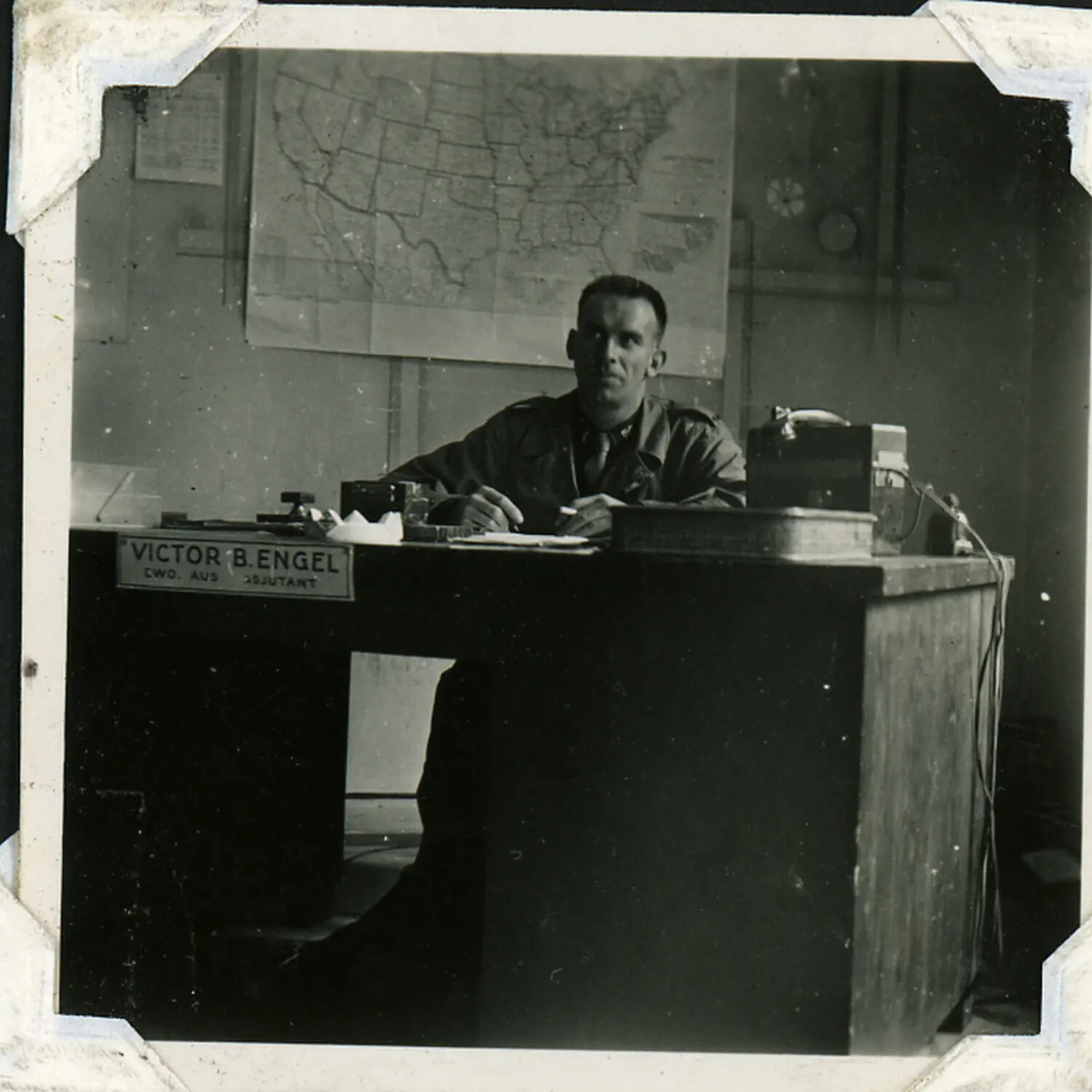 Chief Warrant Officer Victor B. Engel, Adjutant, at His Office Desk