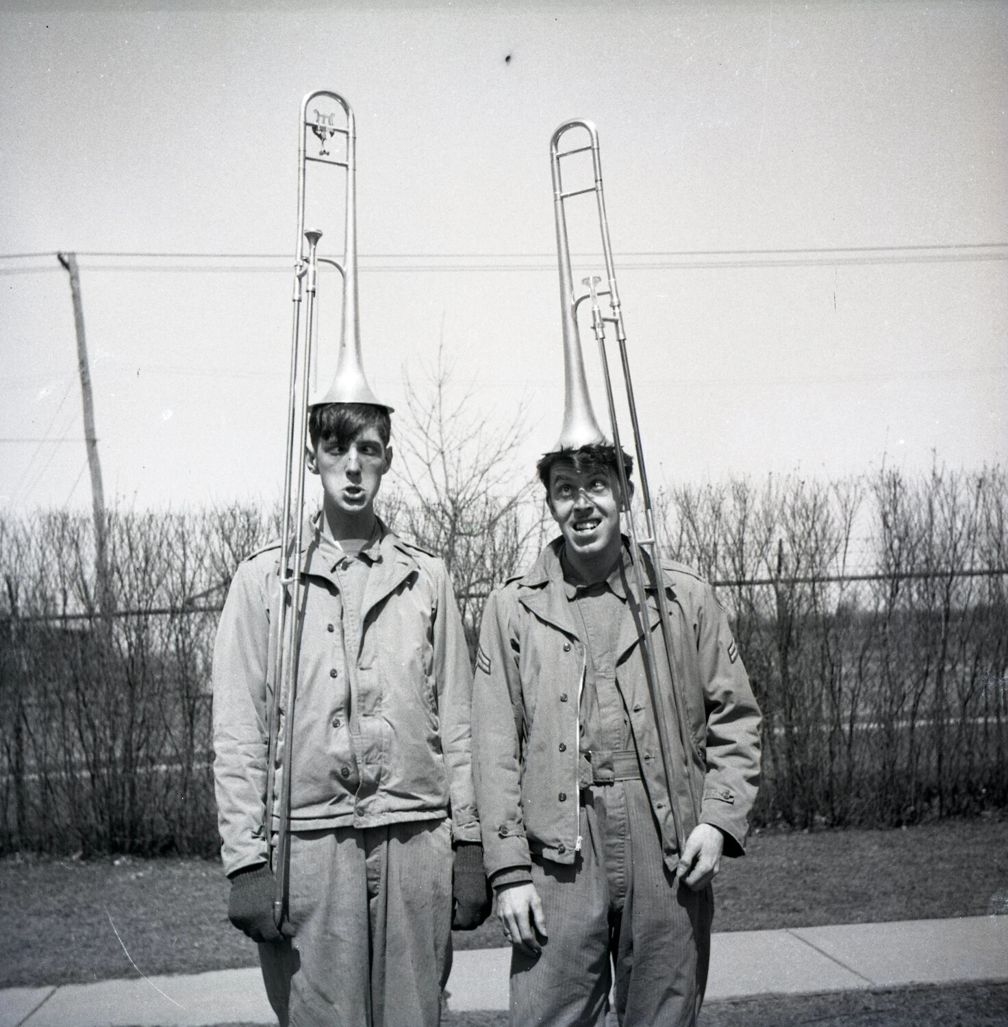 Military Bandsmen Balancing Trombones on Their Heads, Outdoor Base Grounds
