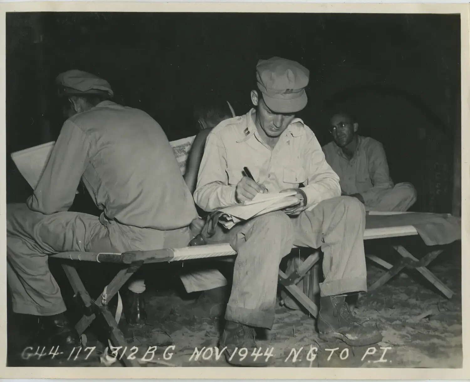 Servicemen Writing Letters on Cots at Night, 312th Bombardment Group, November 1944
