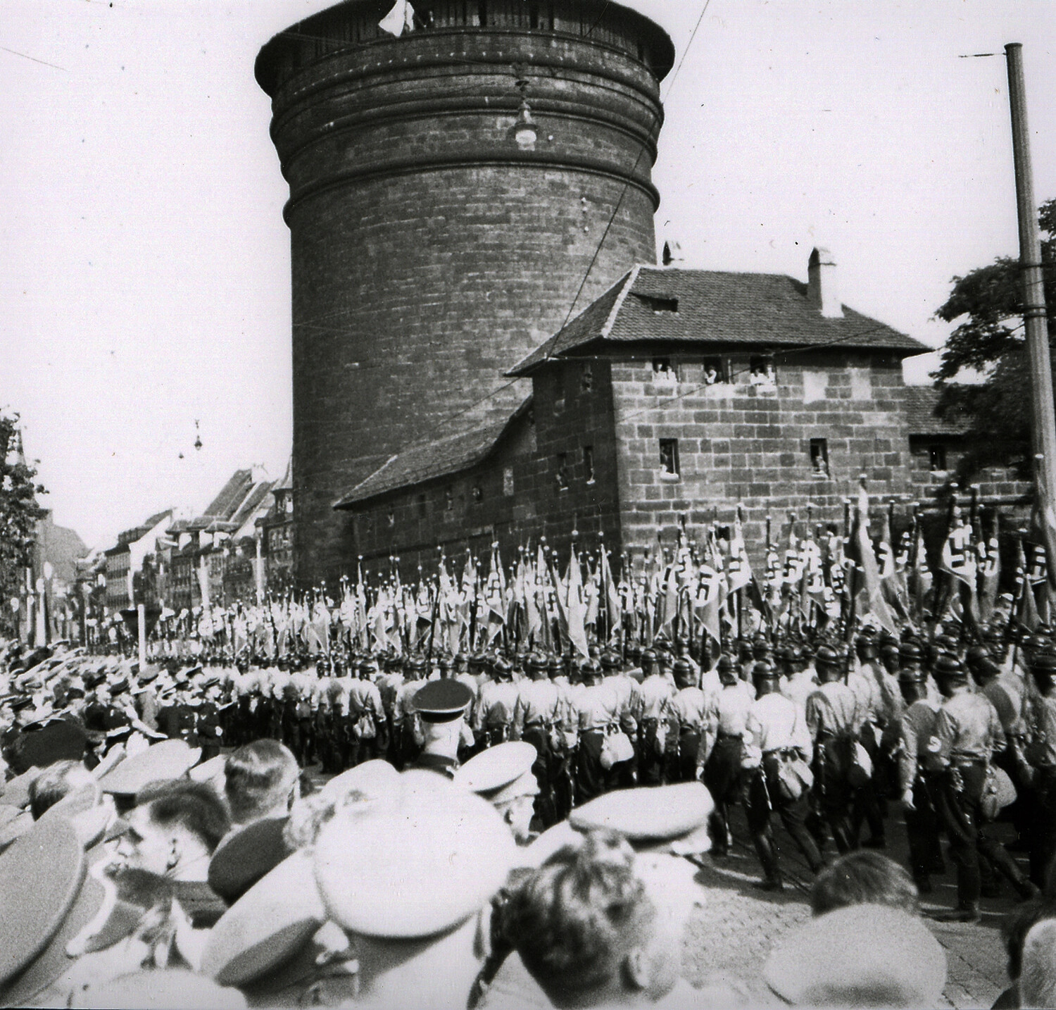 Nazi Party Rally Procession Passing Medieval Tower, Nuremberg, Germany, c. 1930s