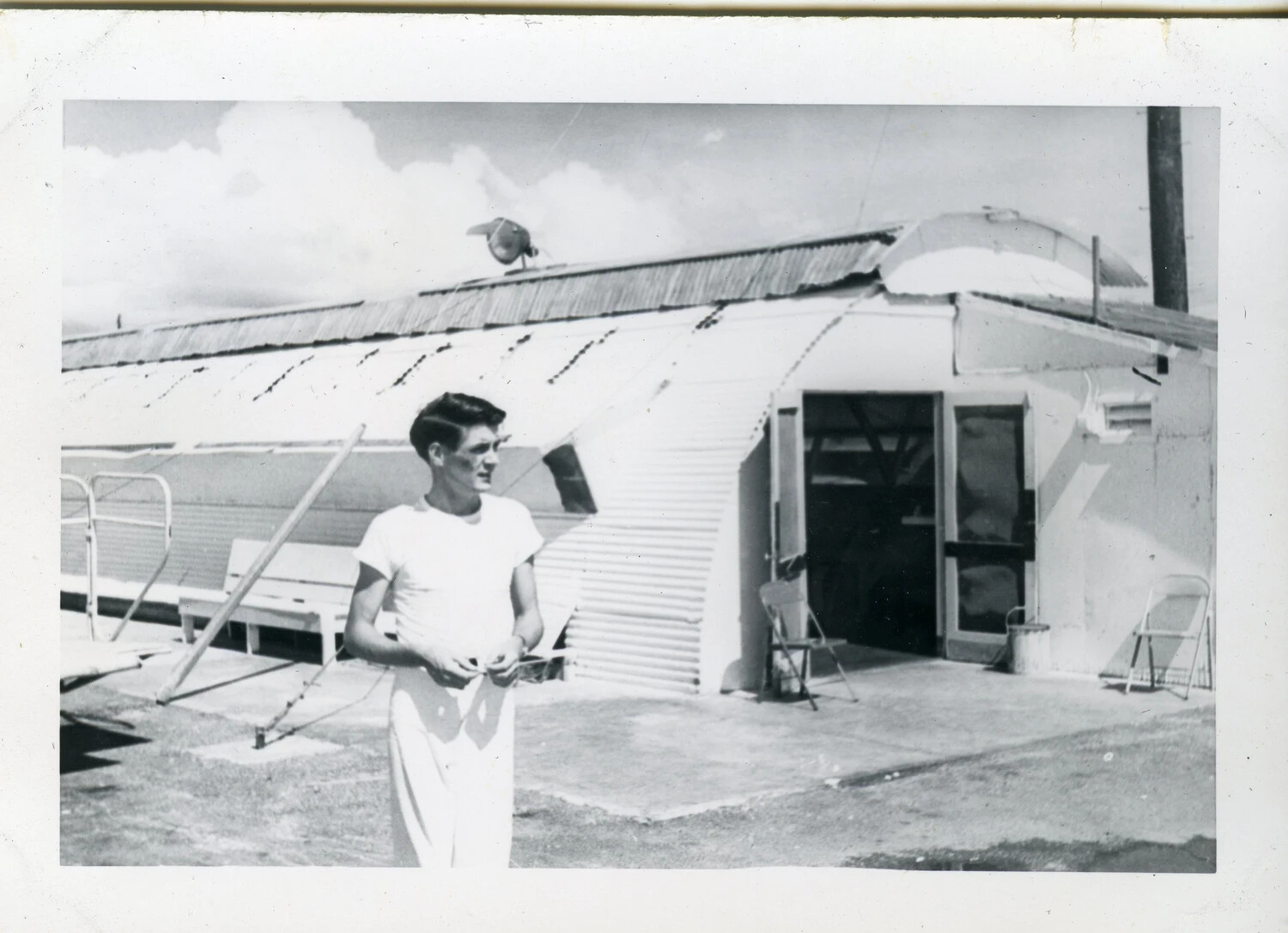 Sailor Beside Quonset Hut, Naval Air Station