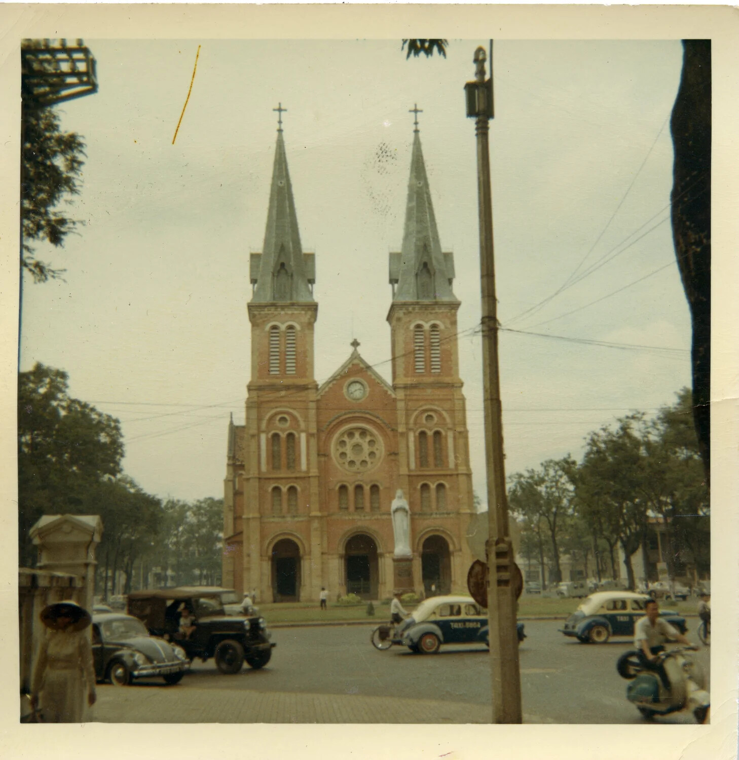Notre-Dame Cathedral Basilica of Saigon and Street Traffic, South Vietnam, 1964
