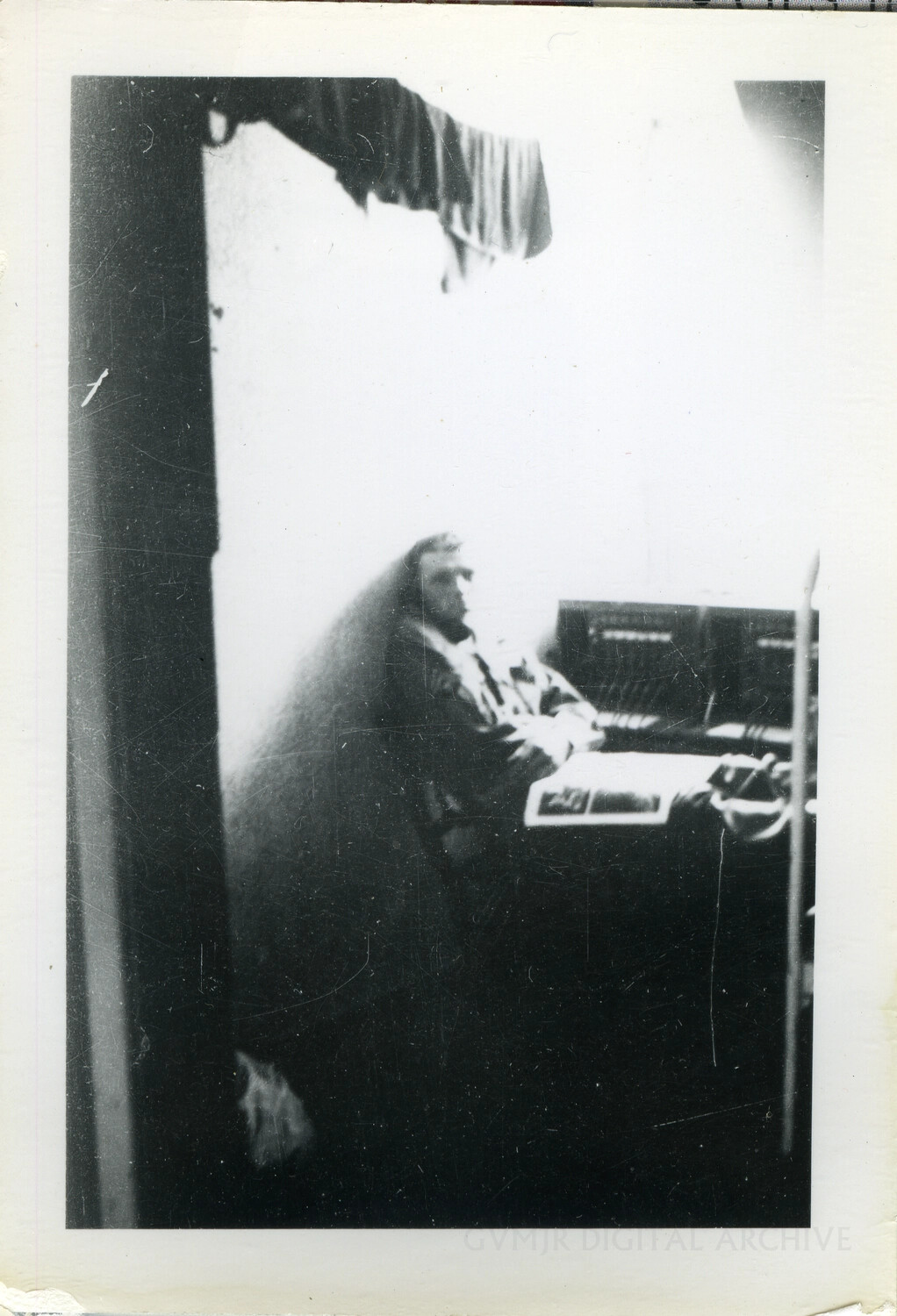 Soldier Operating Field Radio or Switchboard Equipment in Dugout/Command Post, WWII