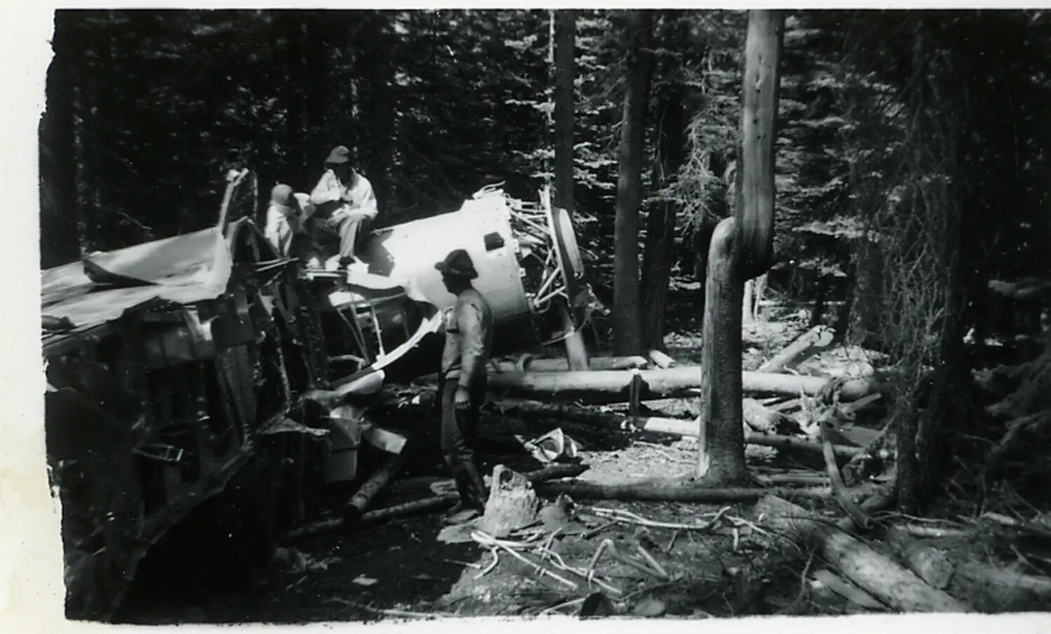Wrecked Single-Engine Radial Aircraft in Forest, with Salvage/Recovery Party — Site and Date Unconfirmed
