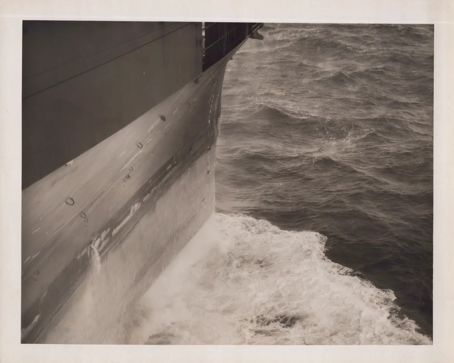 Ship's Bow Cutting Through Rough Seas, WWII Era