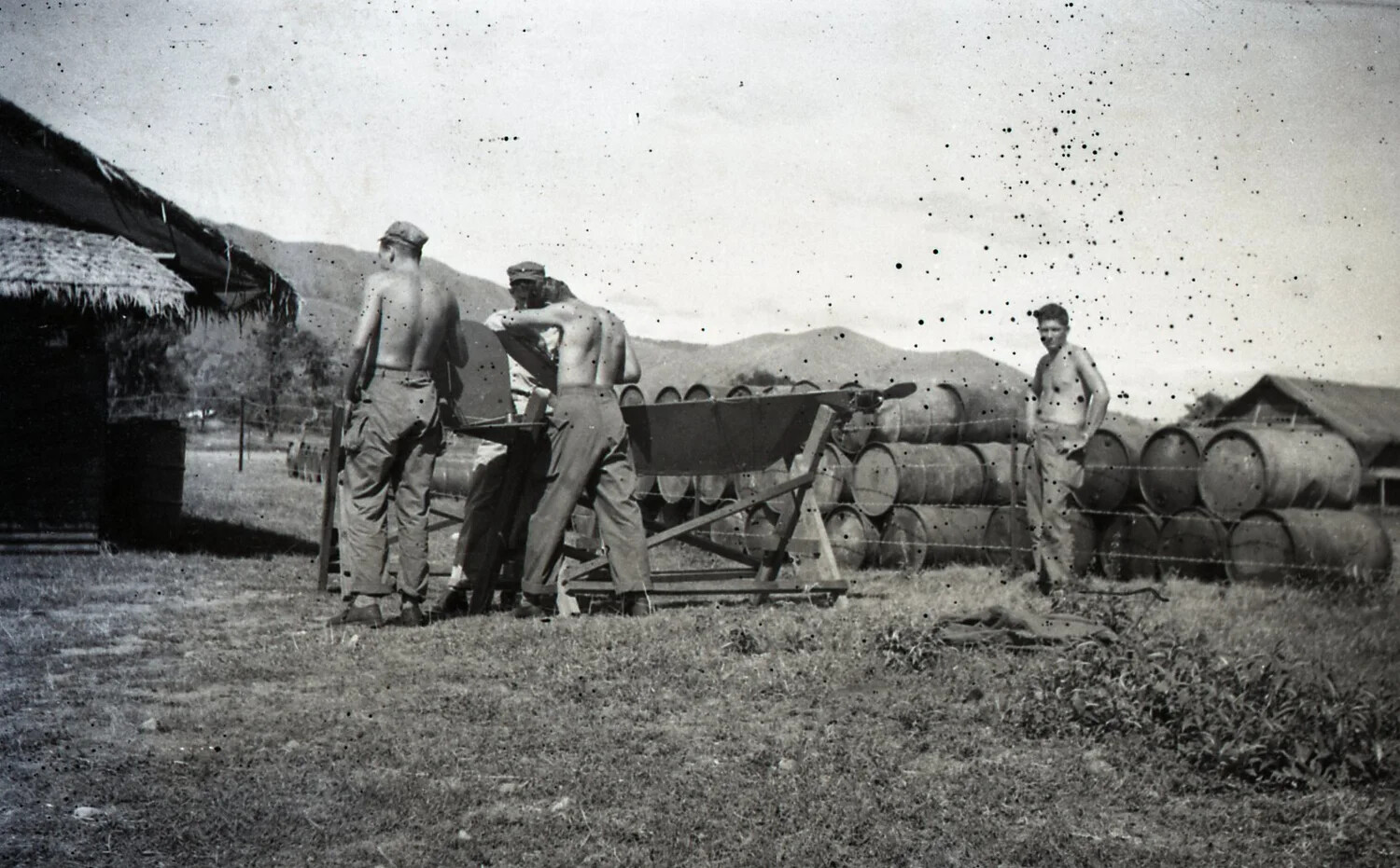 American Servicemen Handling Fuel Drums at a Supply Depot, Luzon, Philippines, WWII