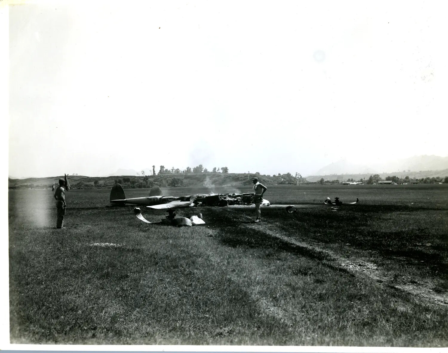 Wrecked and Burned Aircraft in Open Field with Servicemen Examining Wreckage, CBI Theater, WWII