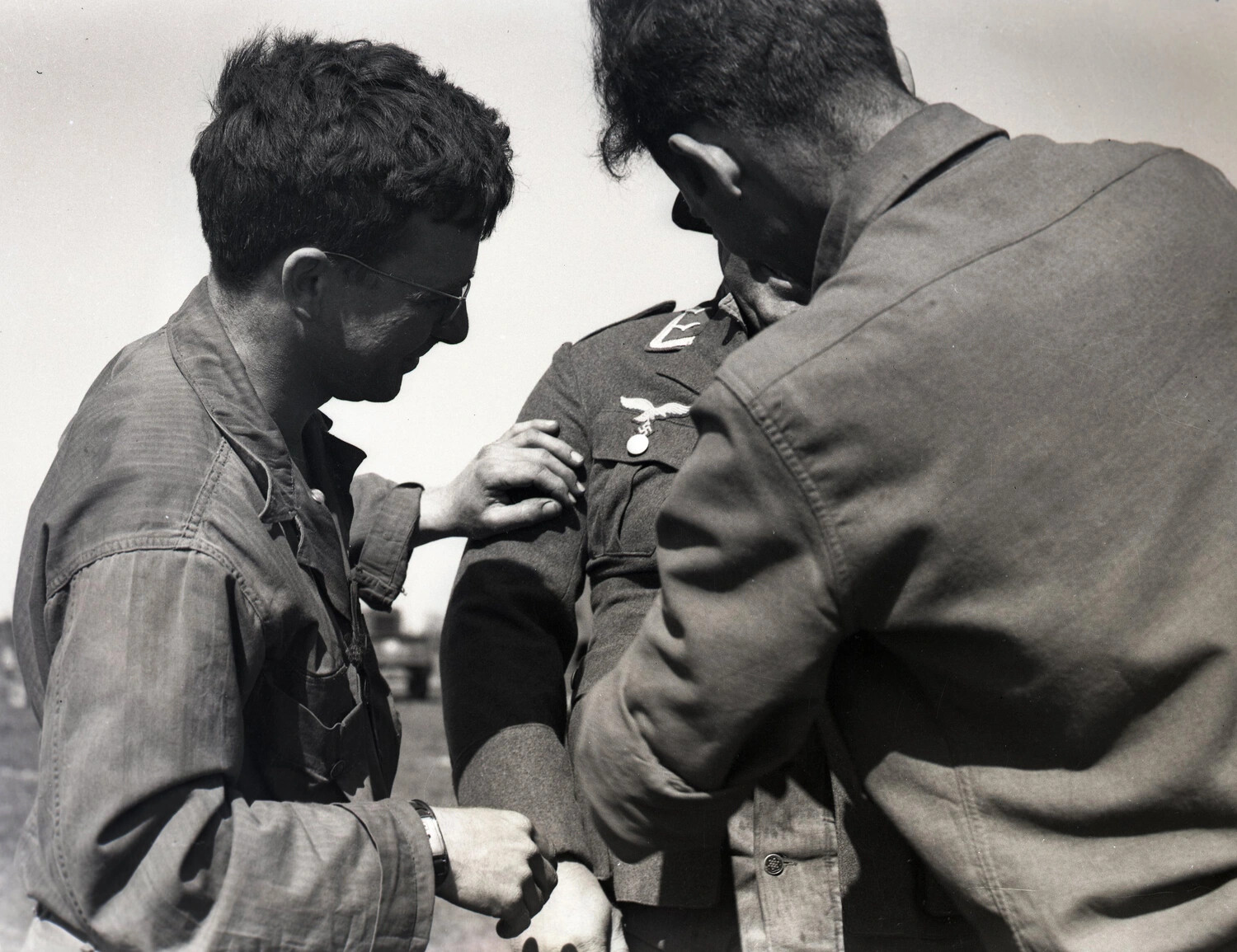 American Servicemen Examining Luftwaffe Uniform Insignia, World War II Germany