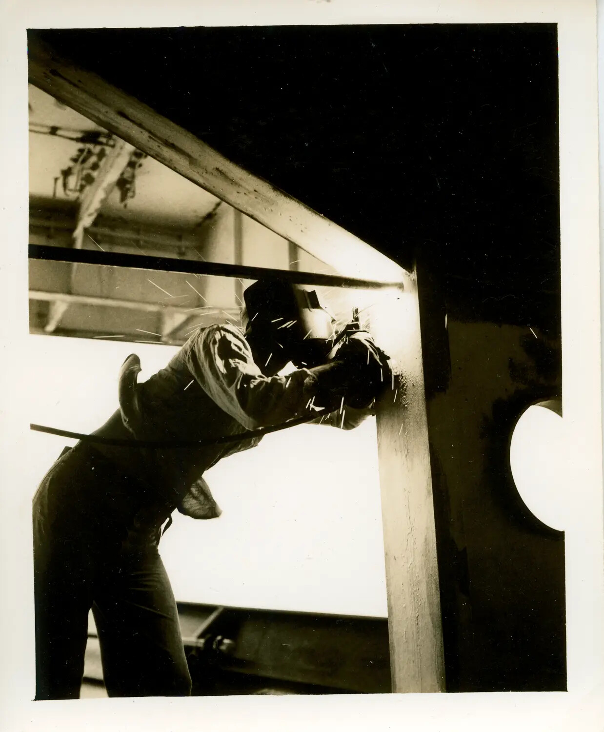 Shipyard Welder at Work During Construction of USS Petrof Bay (CVE-80), World War II