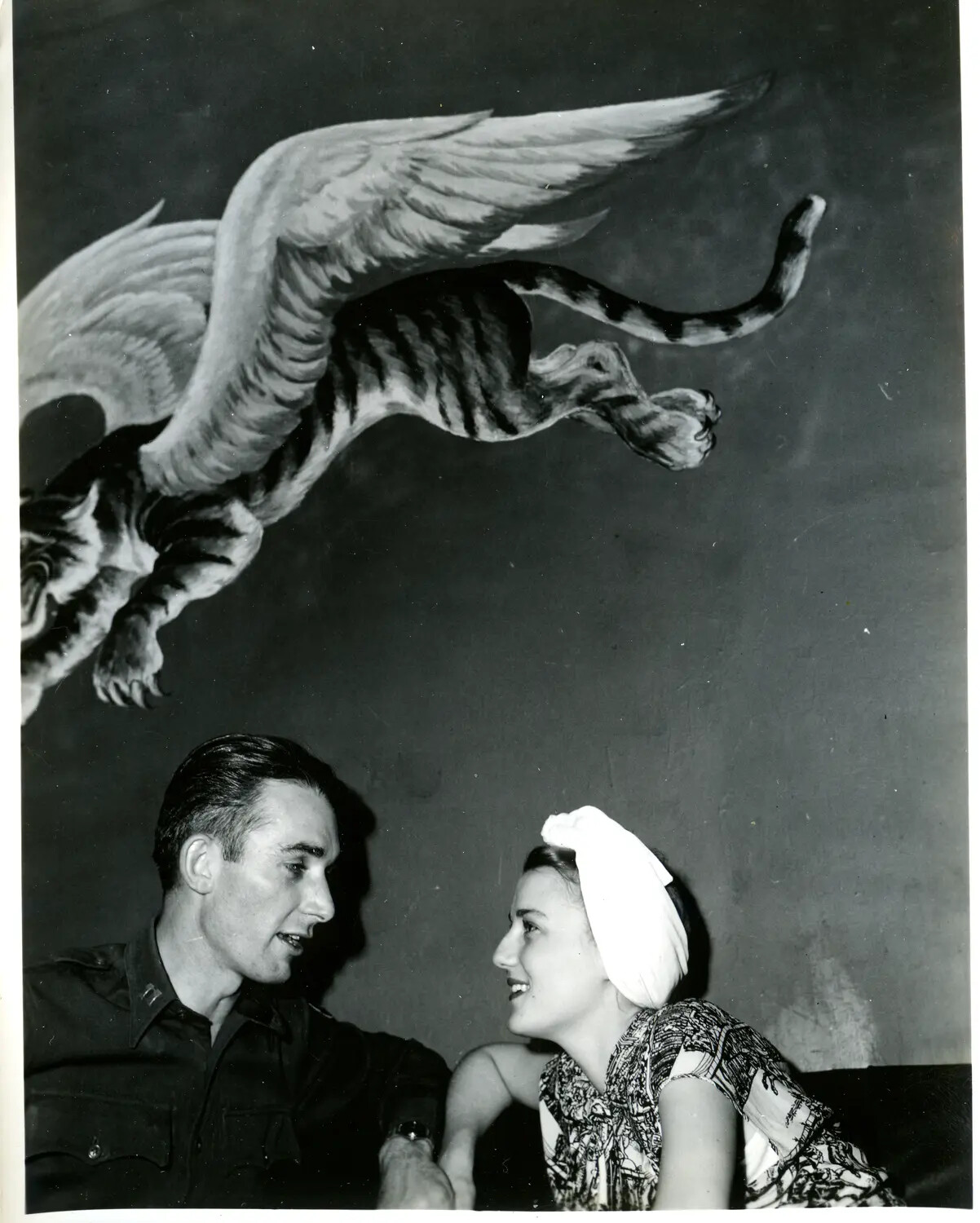 Officer and Companion Beneath Winged Tiger Mural, China-Burma-India Theater, WWII