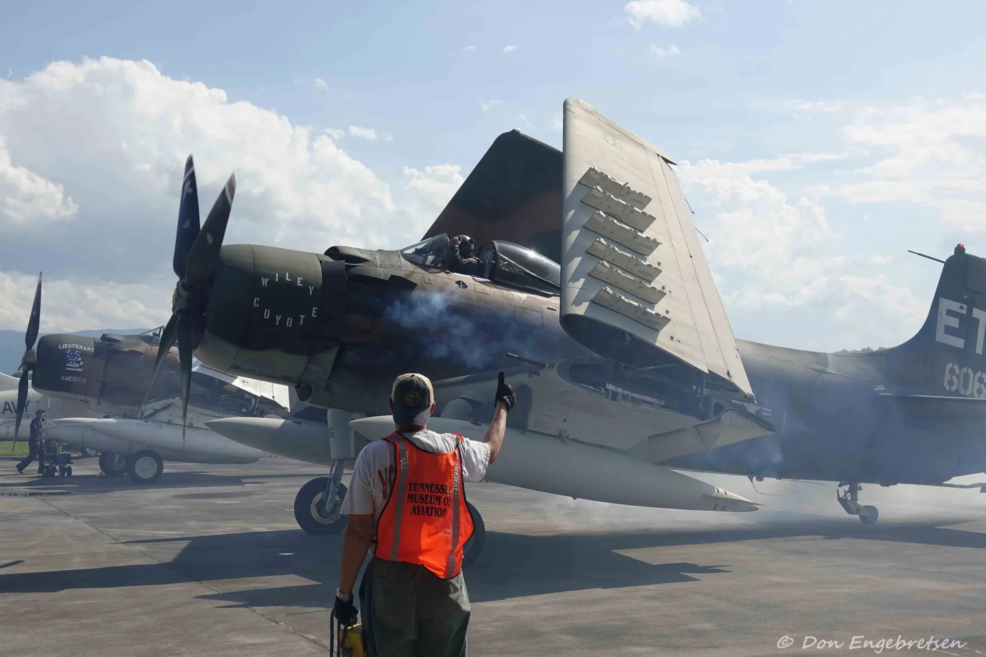 Ground Crew Marshaller Signals A-1 Skyraider 'Wiley Coyote' at Engine Start, Tennessee Museum of Aviation Event, May 2019