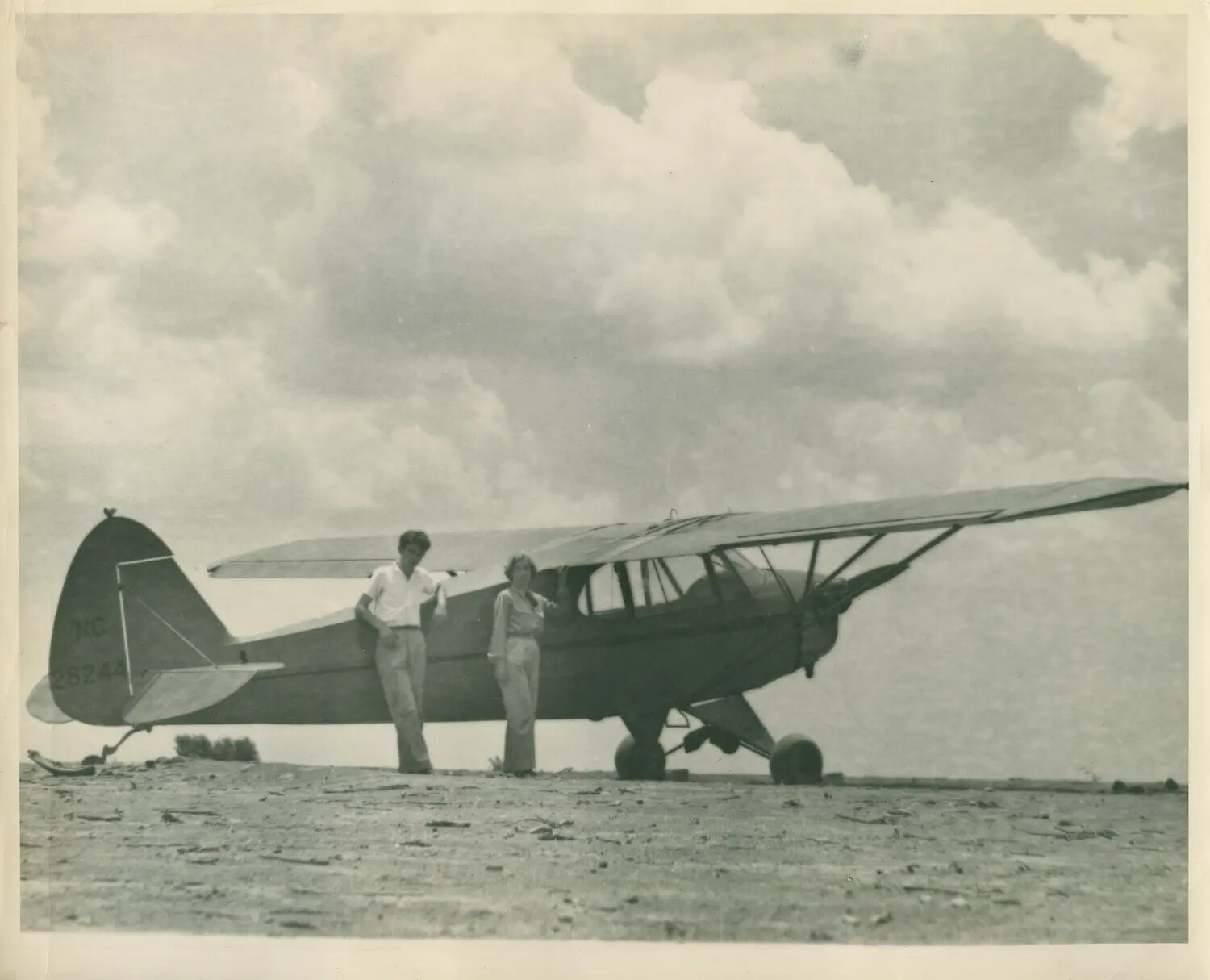 Piper Cub Trainer 'NC28244' with Two Figures on Airfield, Navy V-5 Album