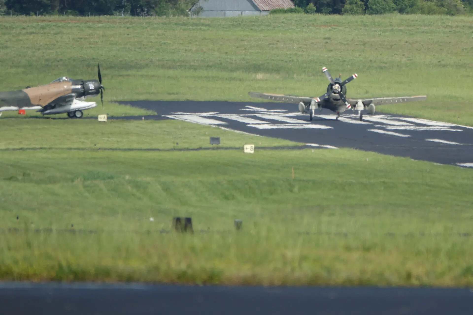 Two A-1 Skyraider Warbirds on Airfield, May 2019 Fly-In Event